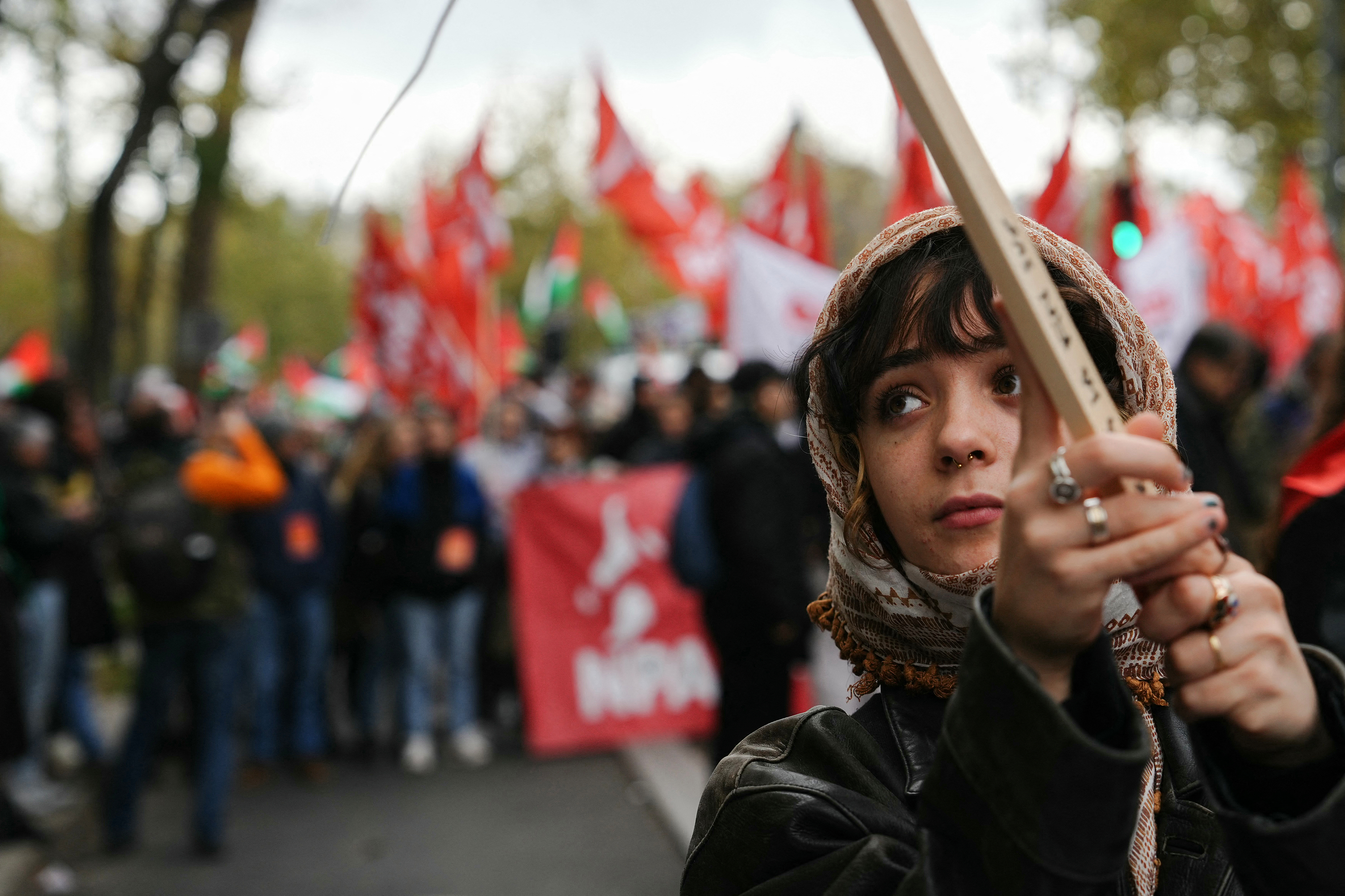 Protesters part in a demonstration to demand an immediate ceasefire in Gaza at Place de la Republique in Paris.