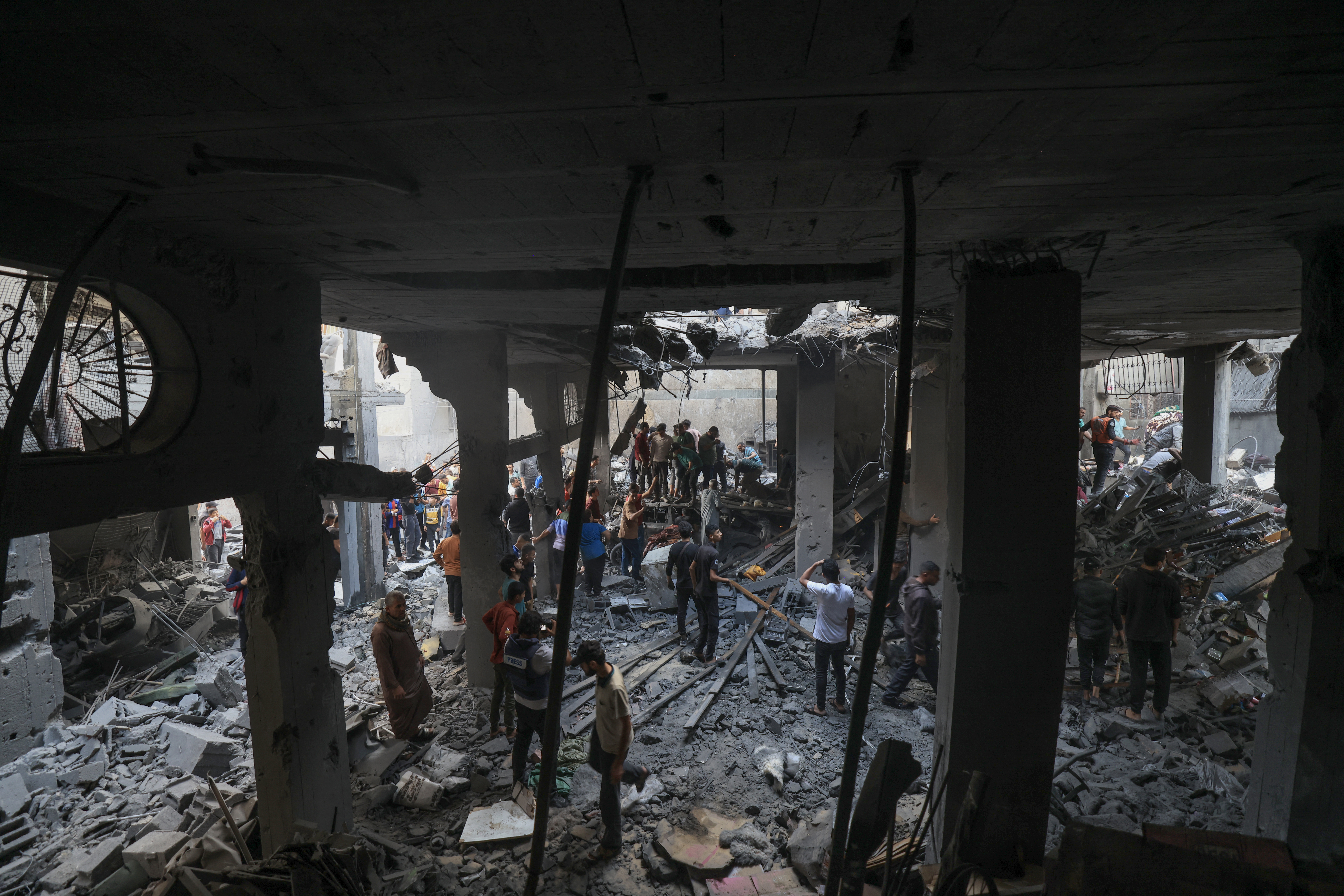 Palestinians search the rubble of a building for survivors follwoing Israeli bombardment in Khan Yunis in the southern Gaza Strip.