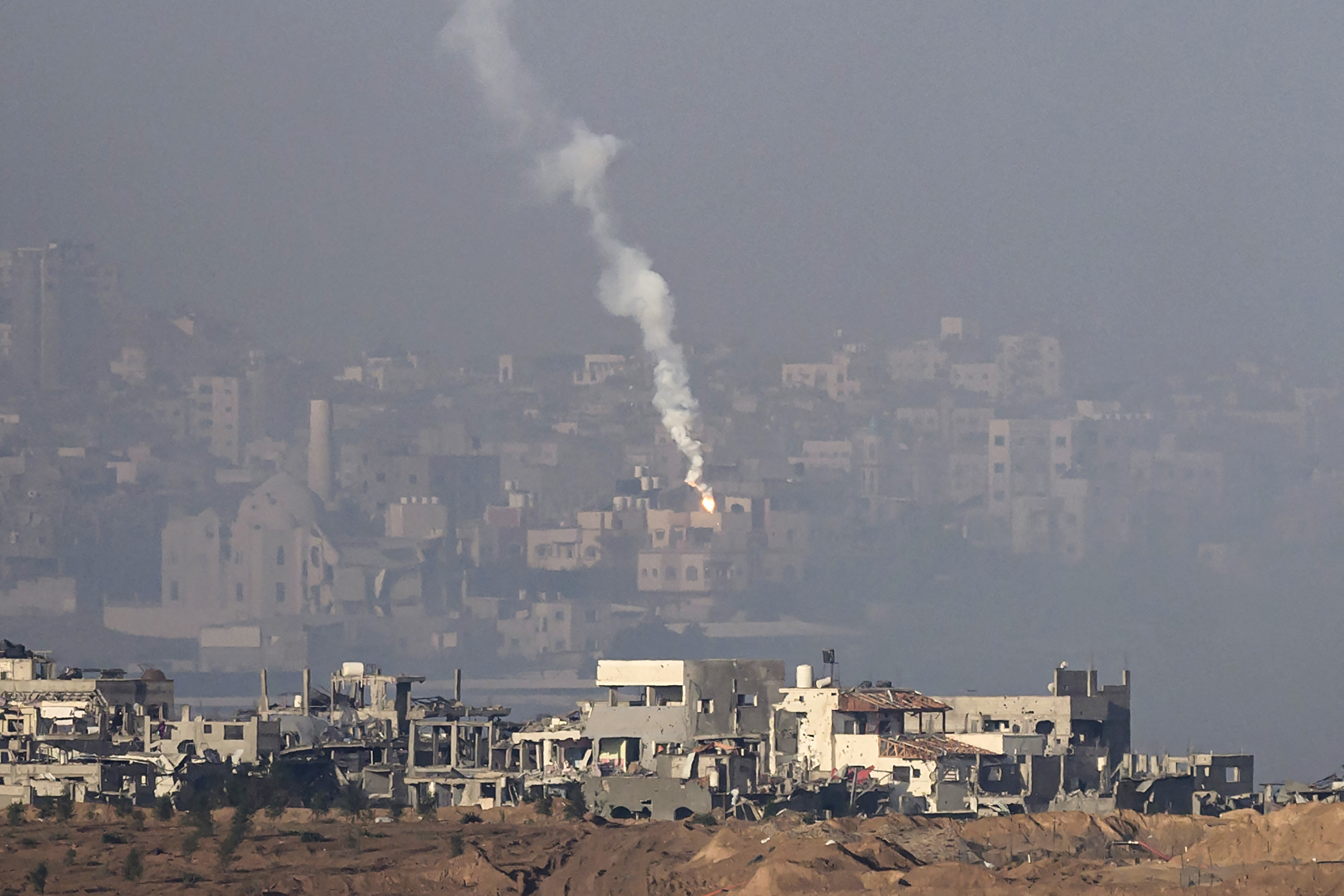 Smoke rises after artillery strikes in Gaza