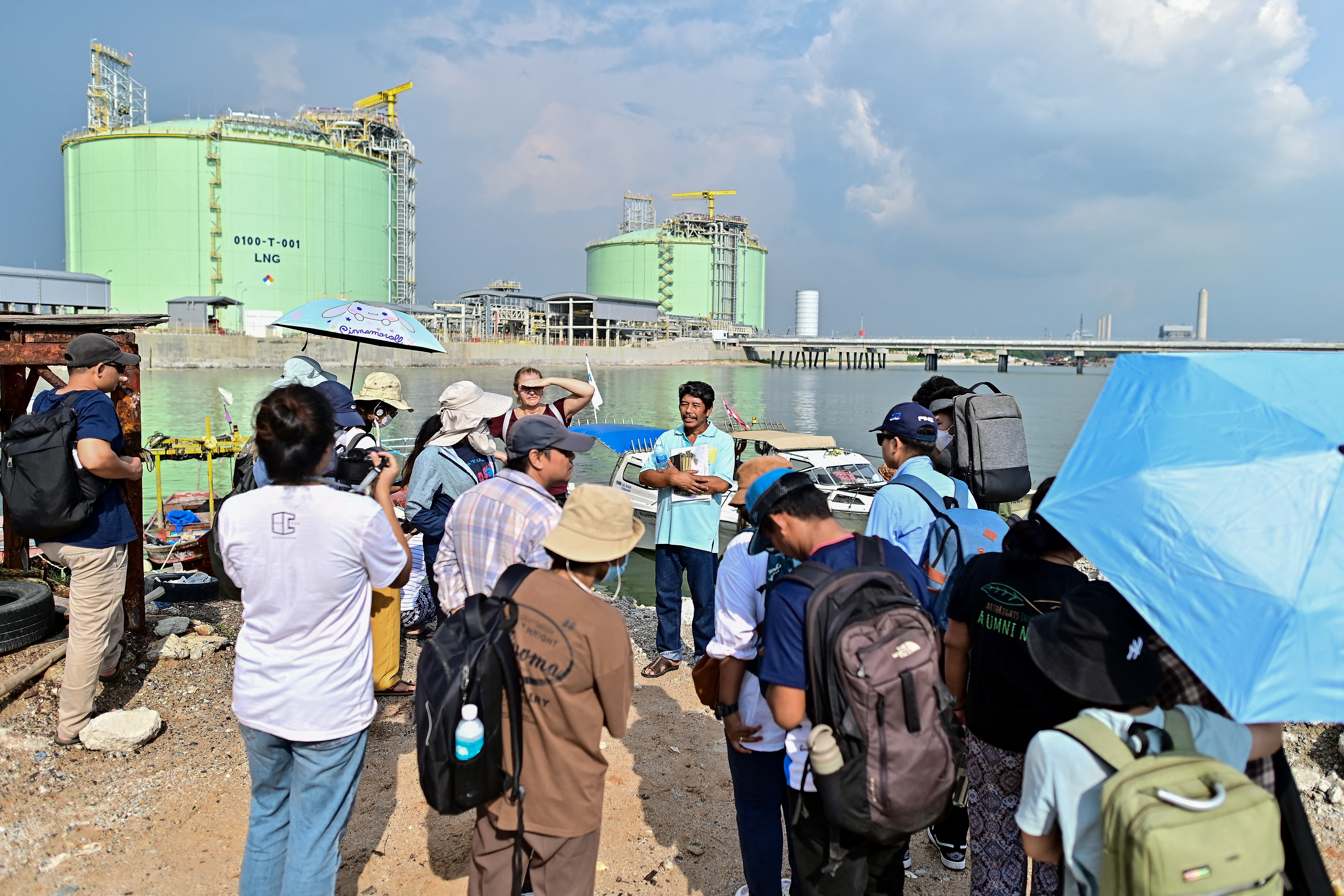 This photograph taken on November 7, 2023 shows environmental activists and students during a field trip at Map Tha Phut industrial zone in the coastal Thai province of Rayong.