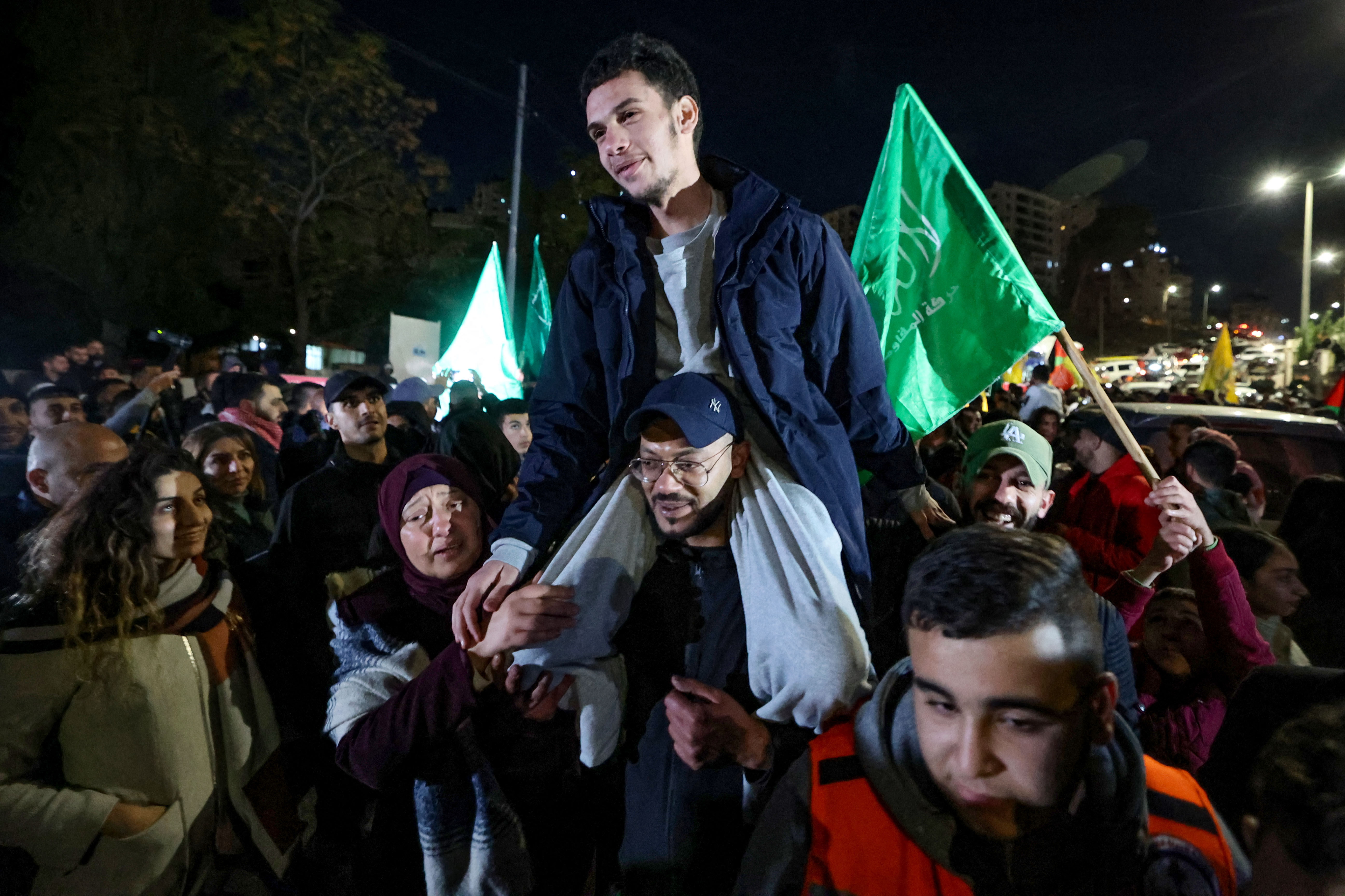 A newly released Palestinian prisoner is carried during a welcome ceremony for prisoners freed from Israeli jails in exchange for Israeli hostages released by Hamas from the Gaza Strip, during a welcome ceremony in Ramallah in the occupied West Bank.