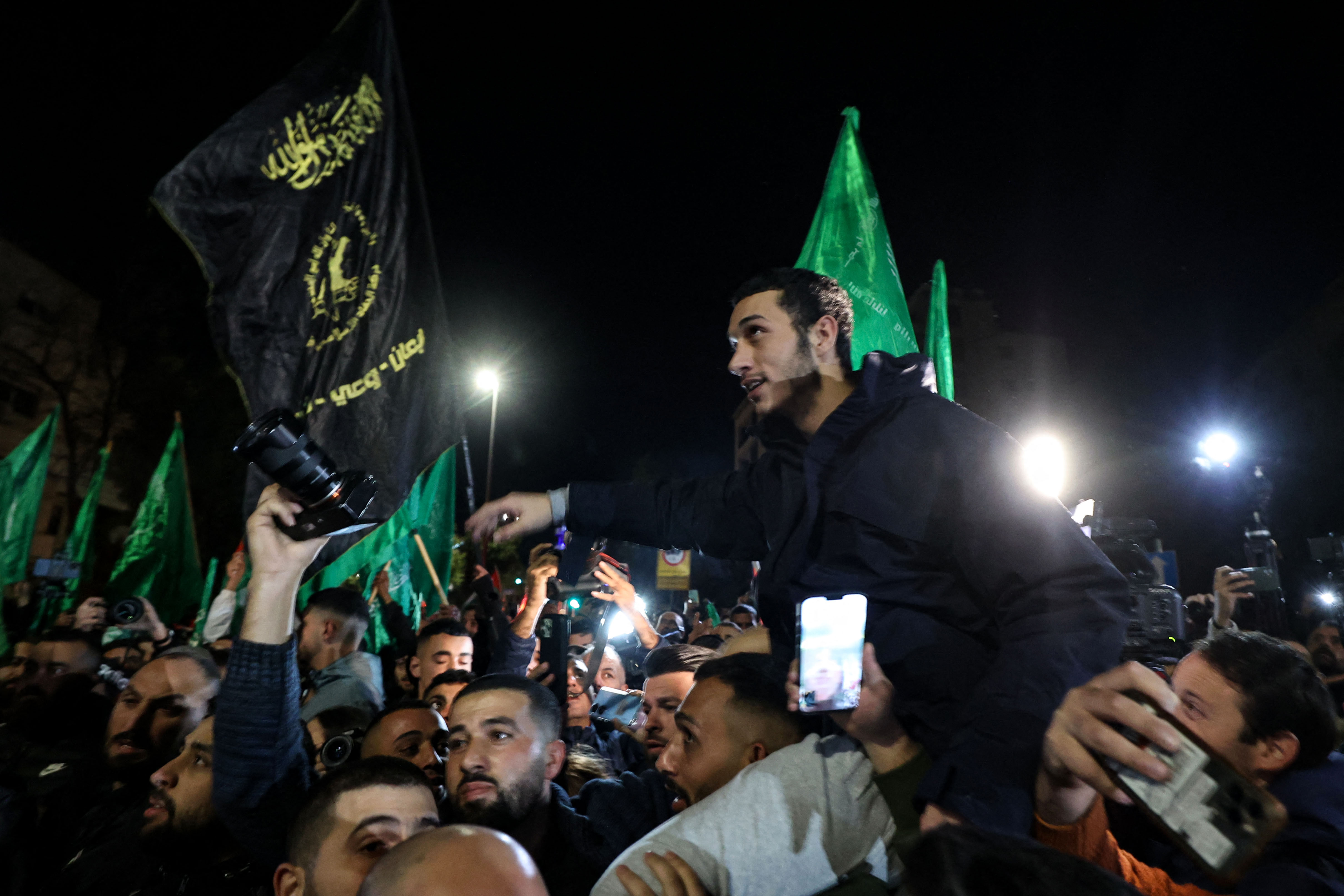 Newly released prisoners are surrounded by supporters during a welcome ceremony following the release of Palestinian prisoners from Israeli jails.