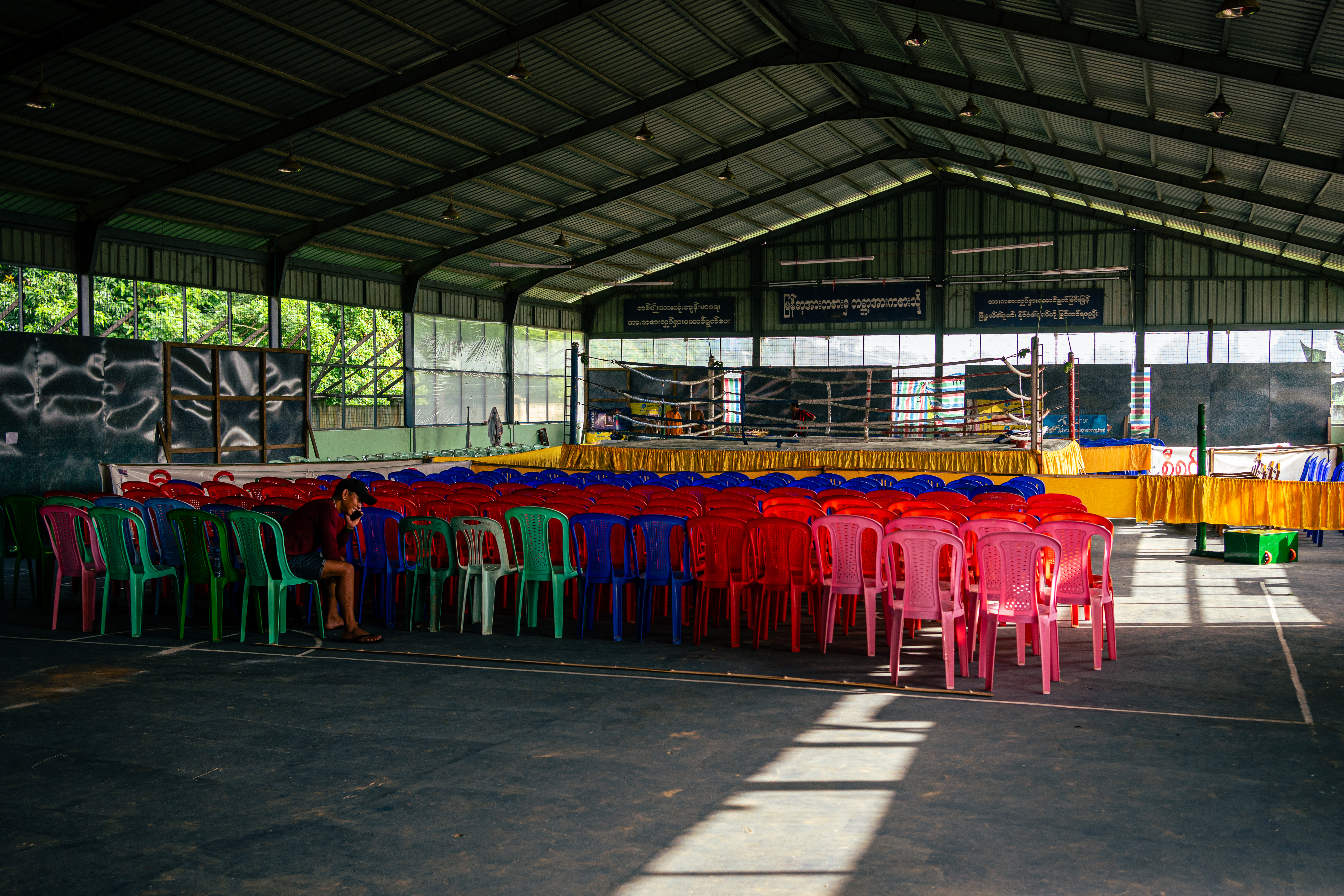 The ring and seats are set up early – the fight card begins around midday and is done by 5pm, helping fighters from further afield get back before the night-time curfew that has been in place since the military seized power.