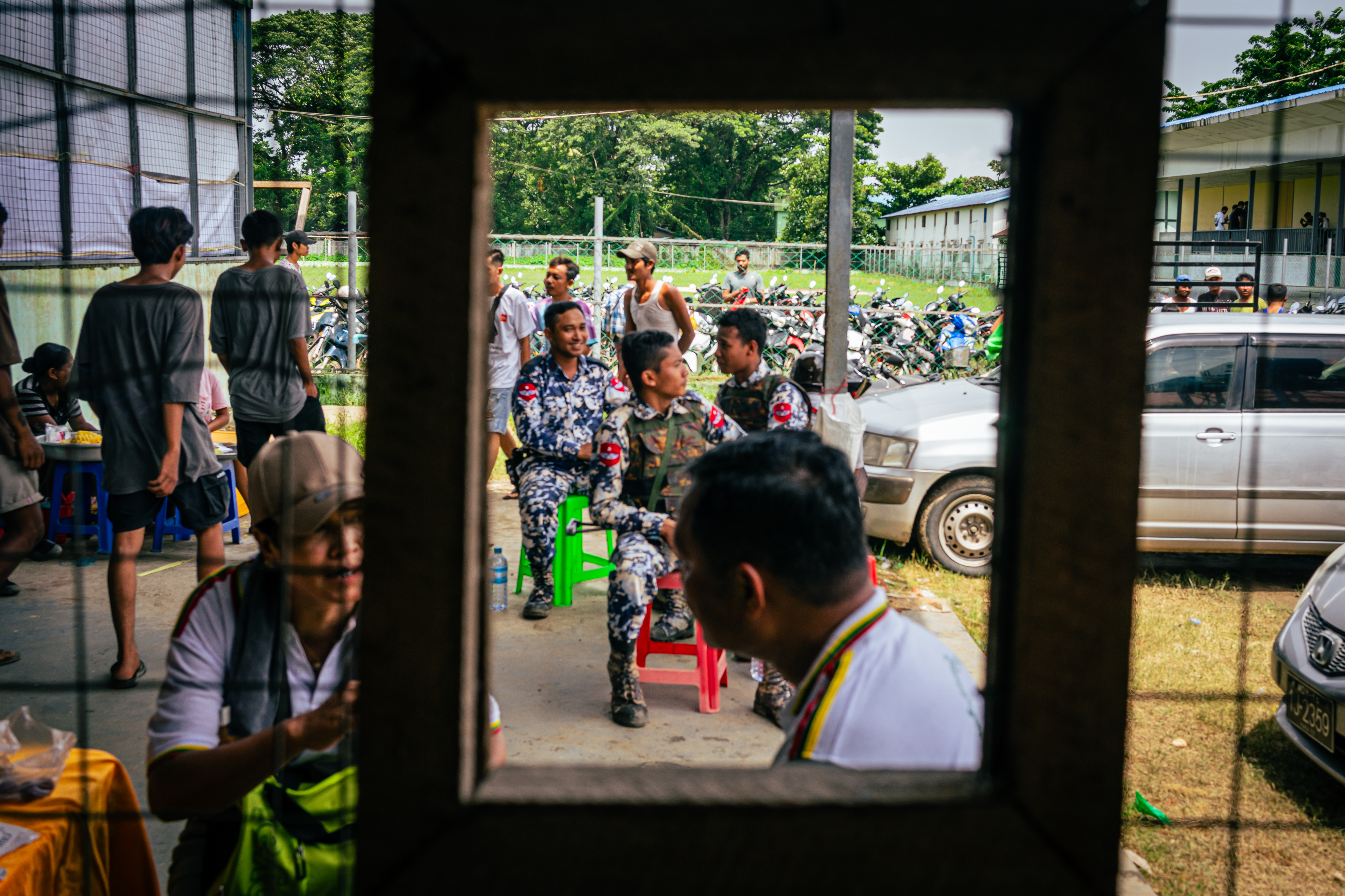 Members of Myanmar’s Air Force provide security for the event, inspecting the bags of those entering the venue.