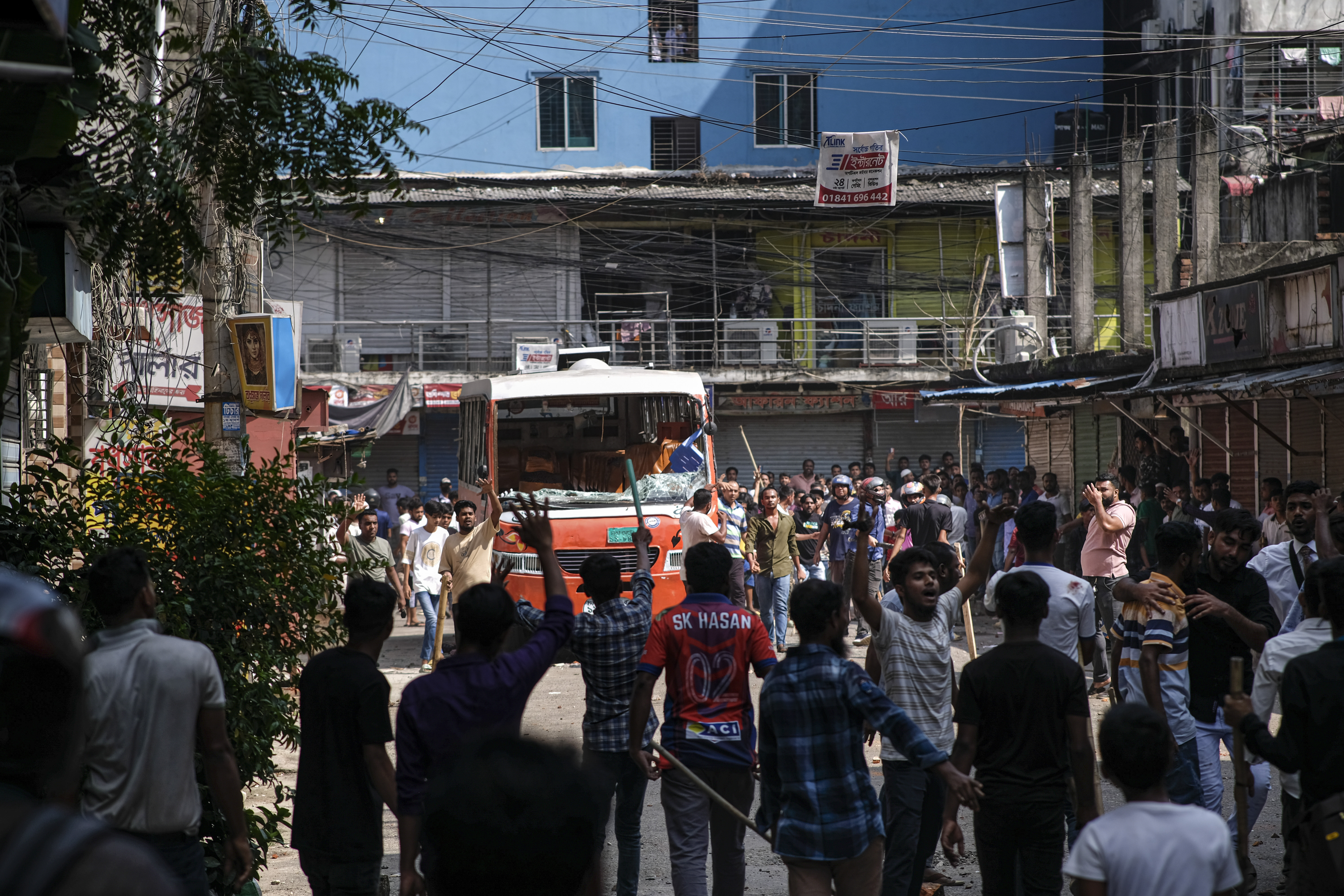 Bangladeshi garment workers vandalize buses during a protest demanding an increase in their wages at Mirpur in Dhaka, Bangladesh.
