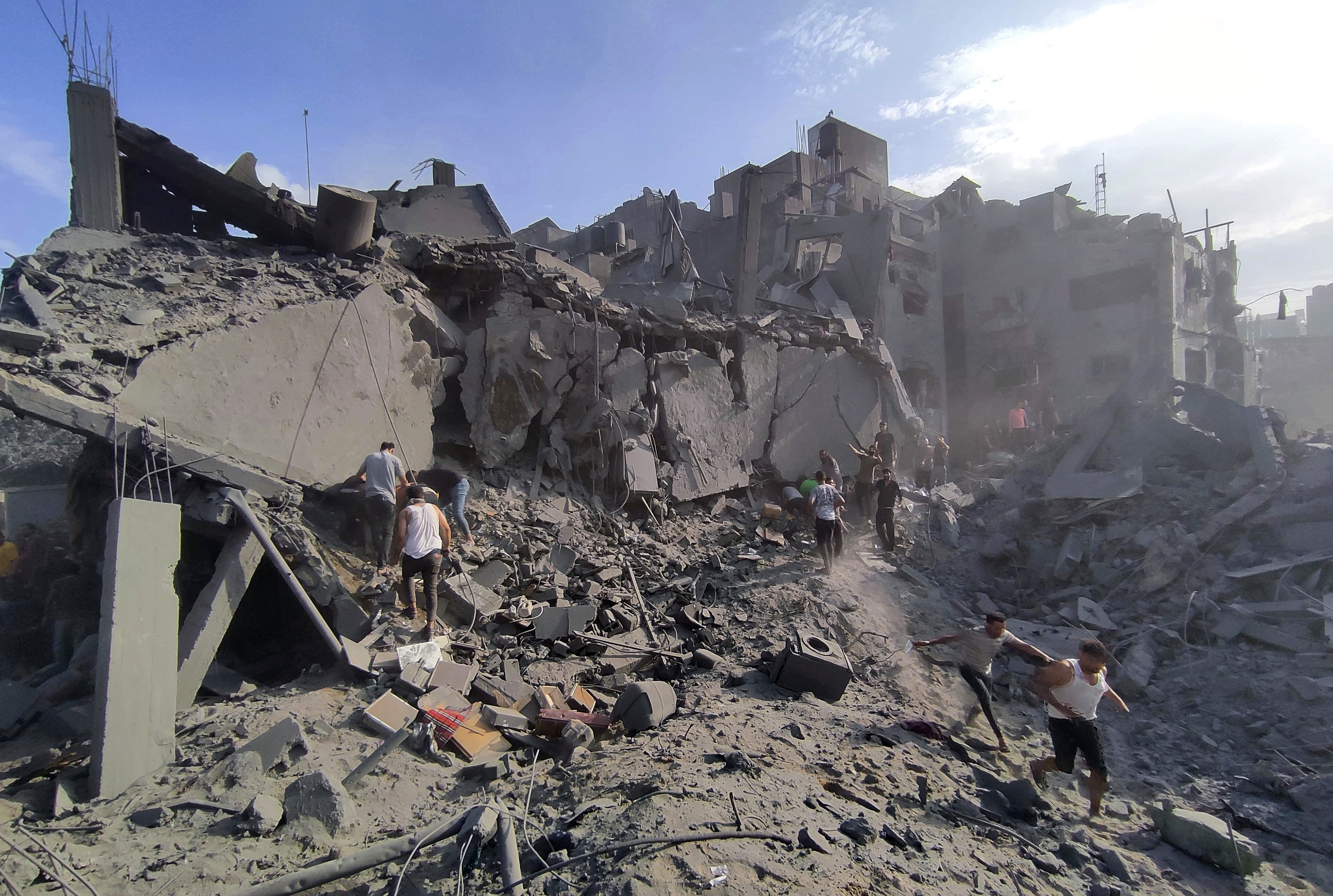 Palestinians inspect the damage of buildings destroyed by Israeli airstrikes on Jabaliya refugee camp on the outskirts of Gaza City