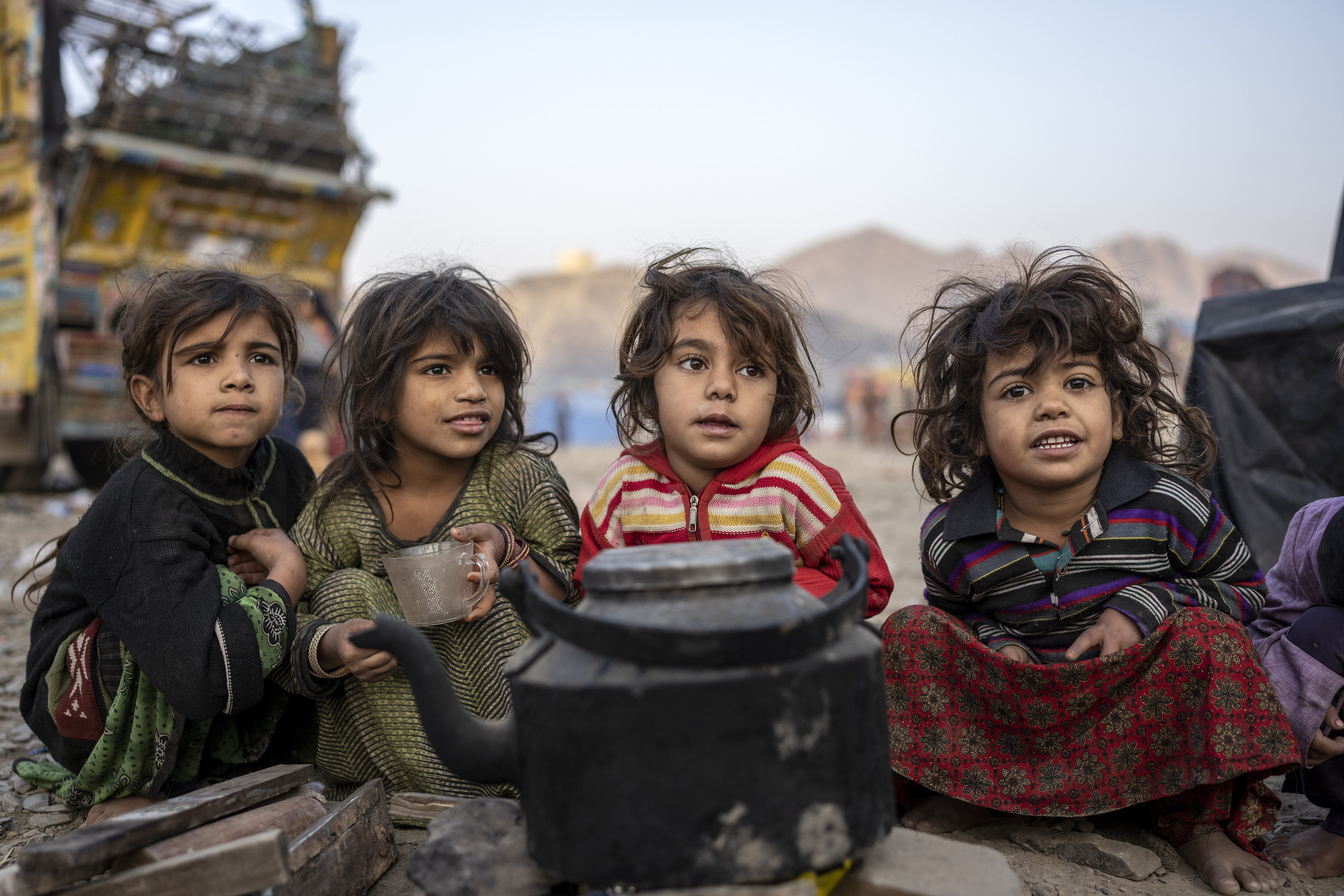 Afghan refugees settle in a camp near the Torkham Pakistan-Afghanistan border in Torkham, Afghanistan, Saturday.