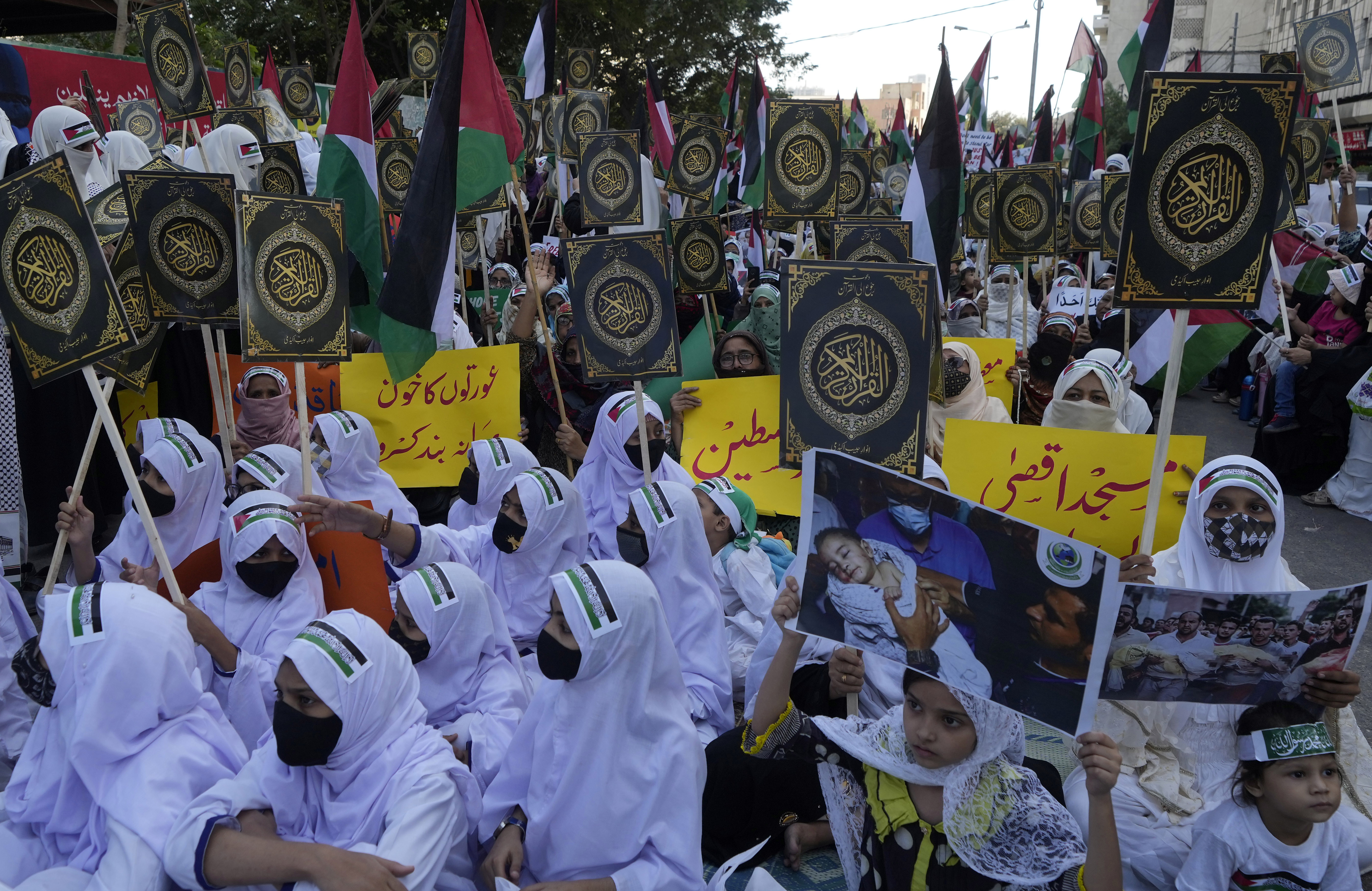 Women including young girls take part in a rally organized by religious group Darul Uloom Anwar Habib against the Israeli airstrikes on Gaza to show solidarity with Palestinian people, in Karachi, Pakistan.