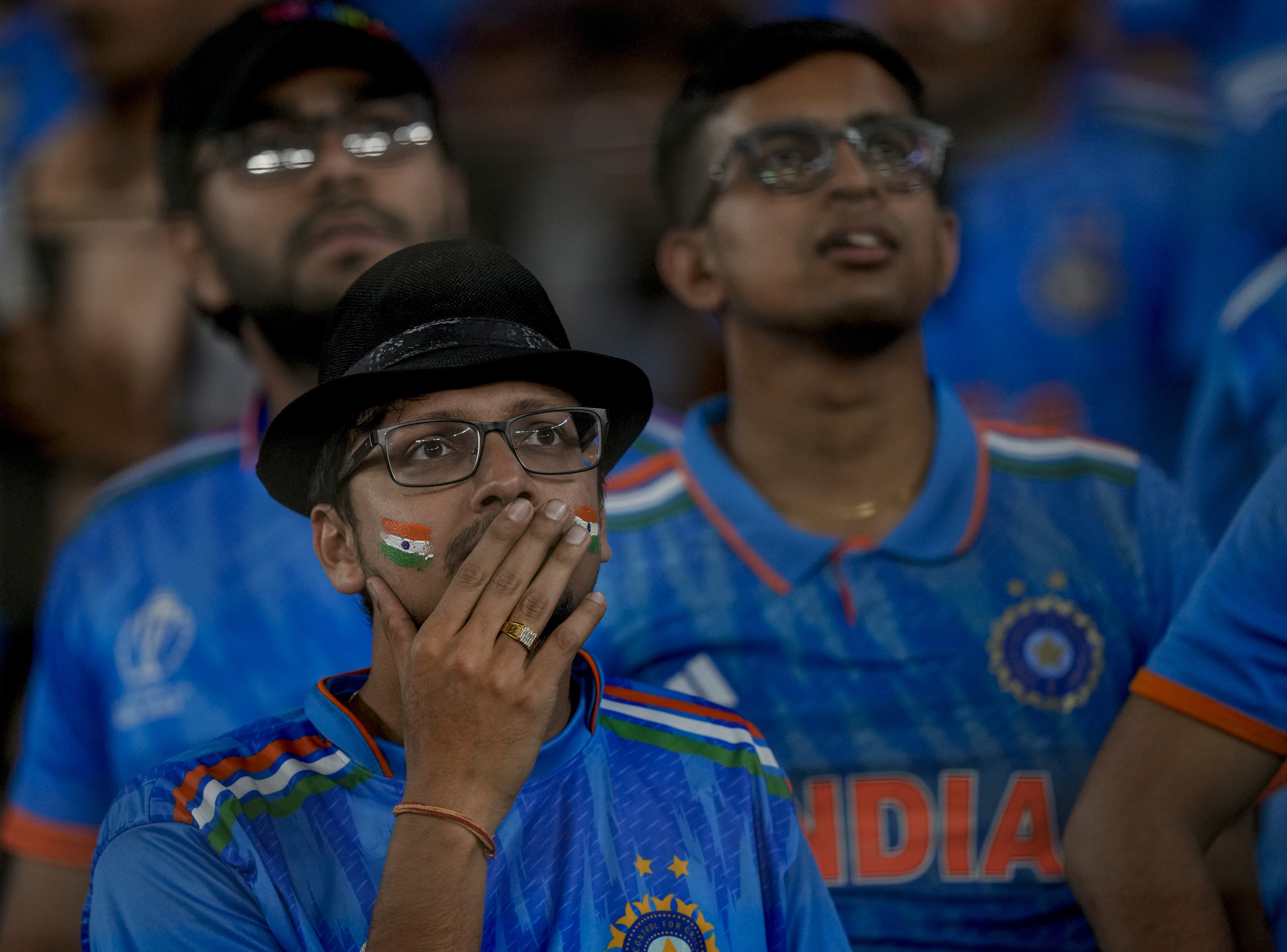 Indian fans react as the watch the ICC Men's Cricket World Cup final match between Australia and India in Ahmedabad, India.