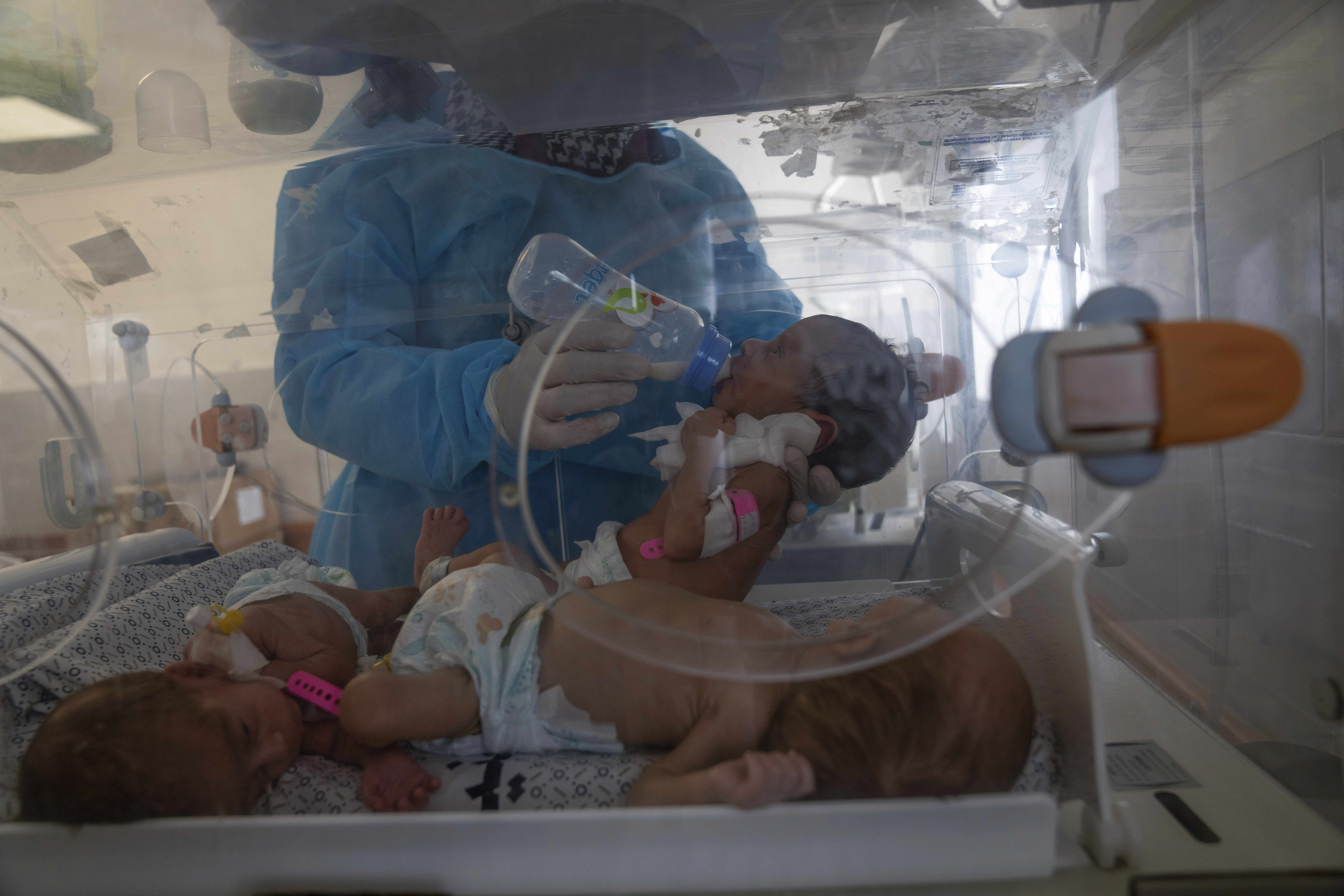 A nurse prepares premature babies for transport to Egypt after they were evacuated from Shifa Hospital in Gaza City to a hospital in Rafah
