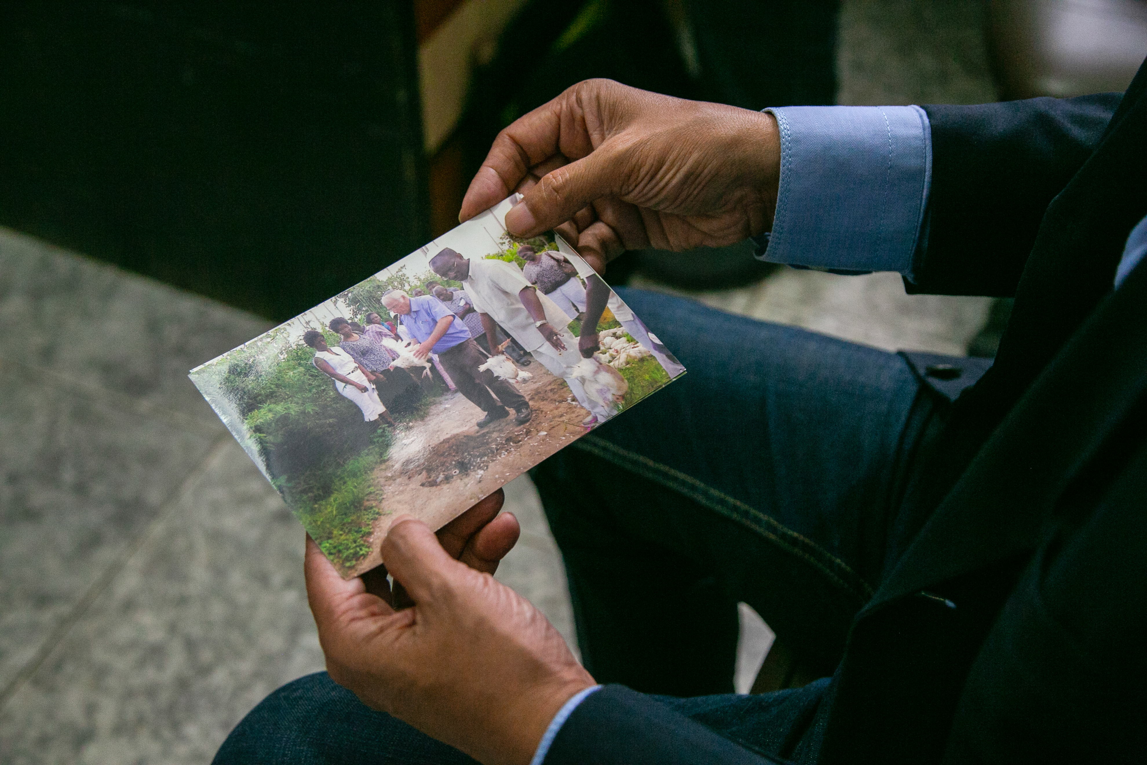 Yehuda Firmin shows a picture of Ariel Palmon teaching the community how to perform kosher slaughterings