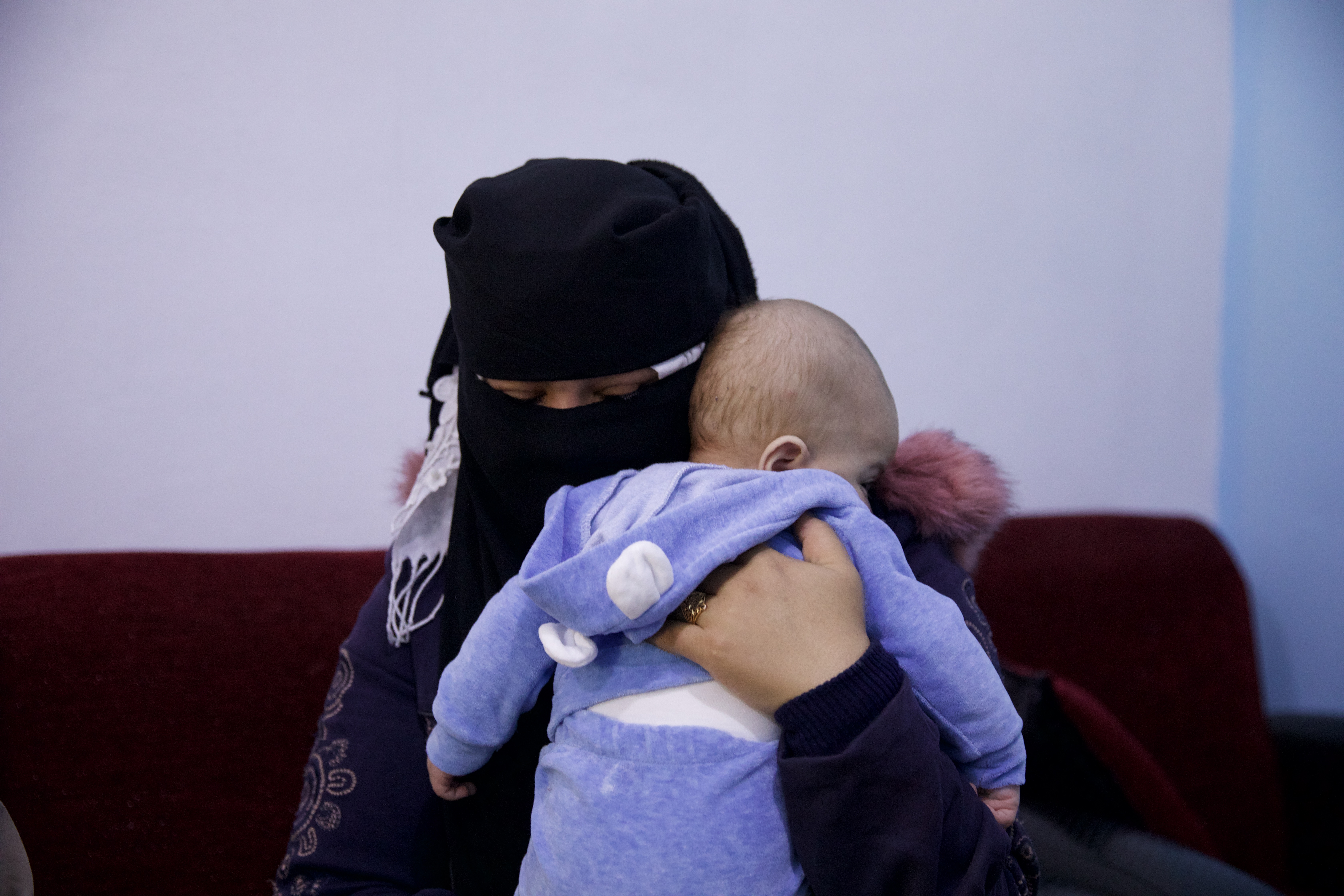 Khawla Ghazi with her new son Ahmed in Child Houses center