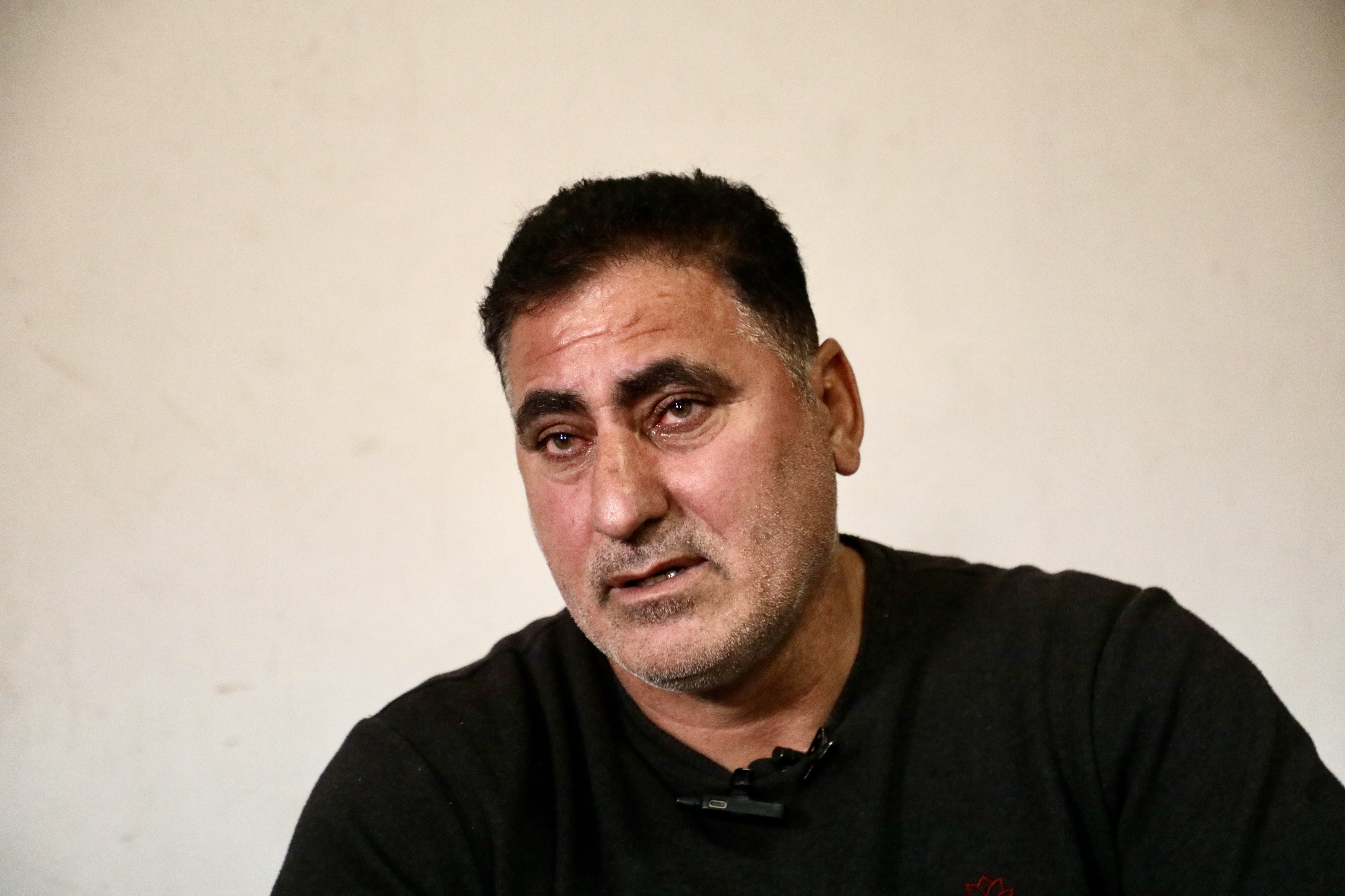 Youssef Abu Maria weeping as he talks about his son