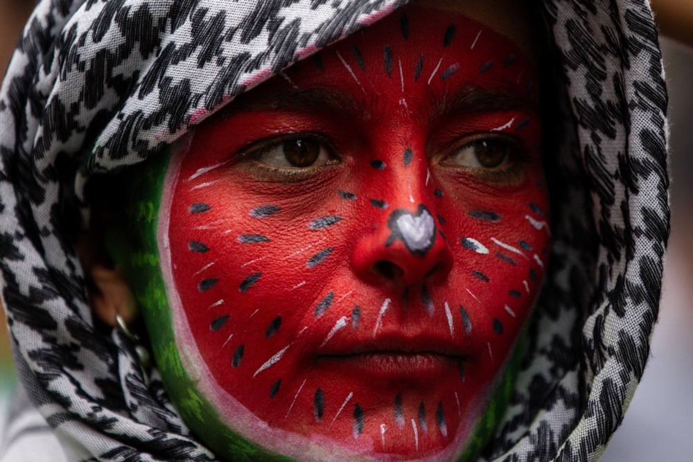 A pro-Palestinian demonstrator looks on during a march towards the Victorian Parliament in Melbourne, Australia.
