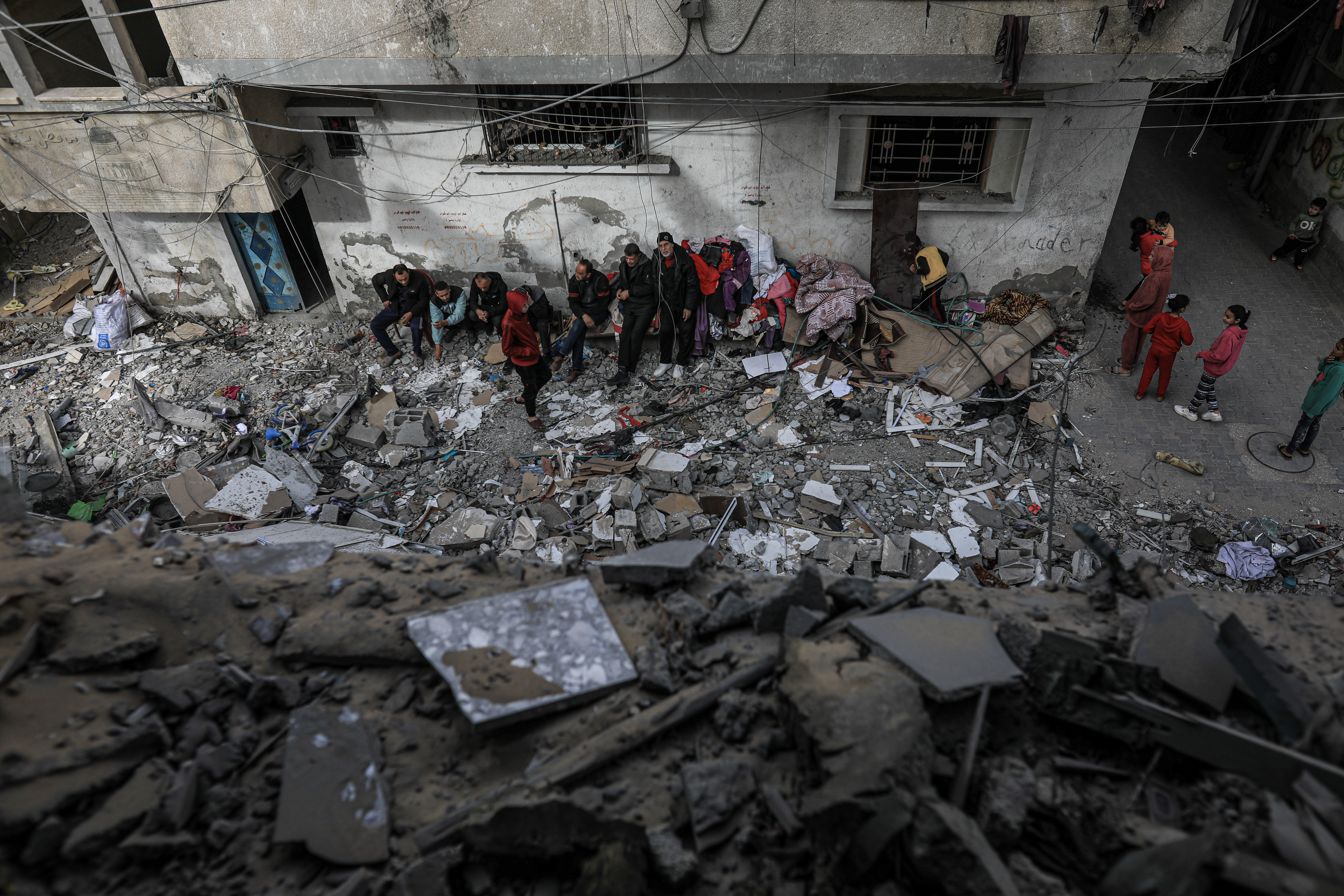 Residents checking the rubble of Khalifa family home that was bombed earlier on Friday