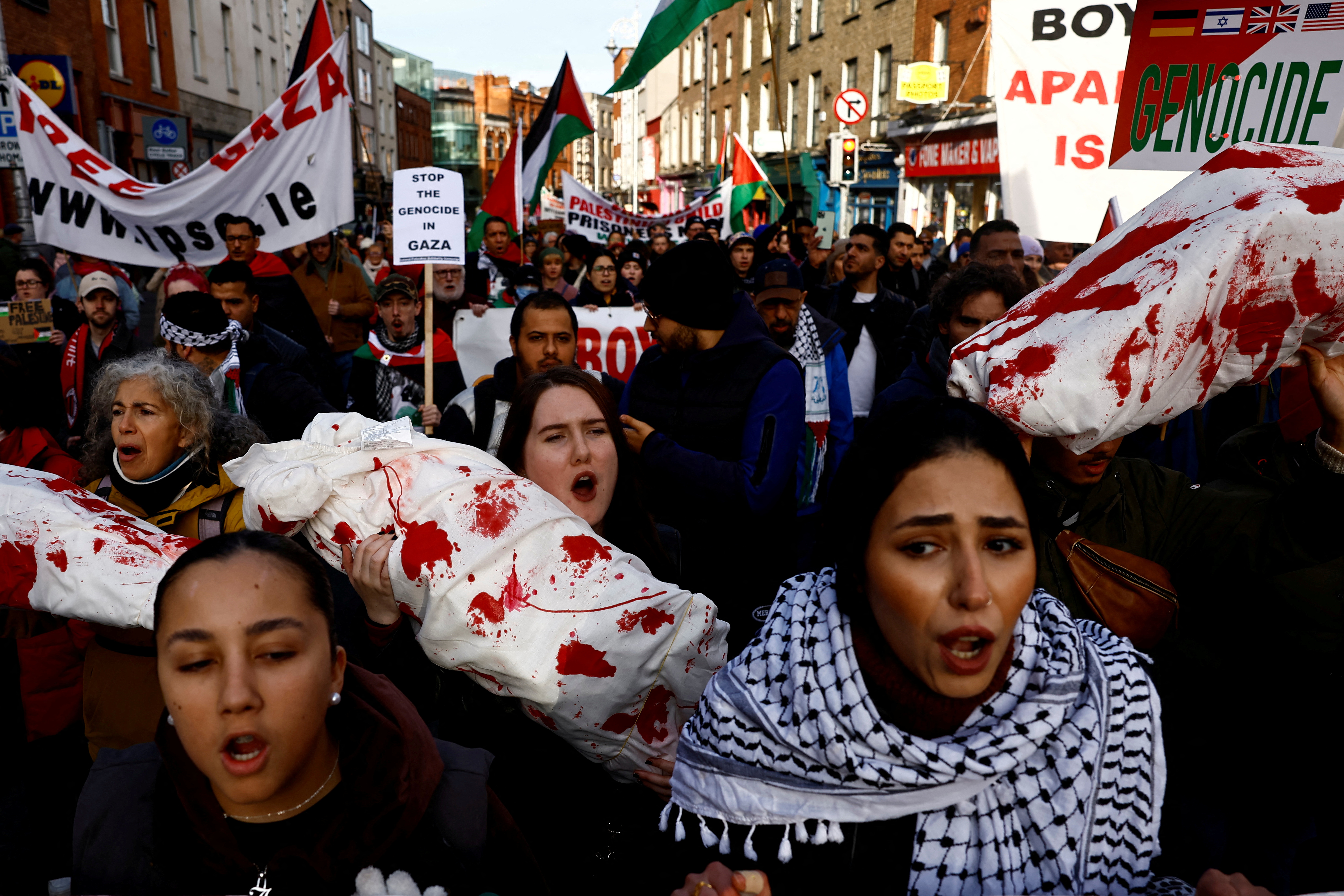 Demonstrators carry props during a protest in solidarity with Palestinians in Gaza, amid the ongoing conflict between Israel and the Palestinian Islamist group Hamas, in Dublin, Ireland, November 11