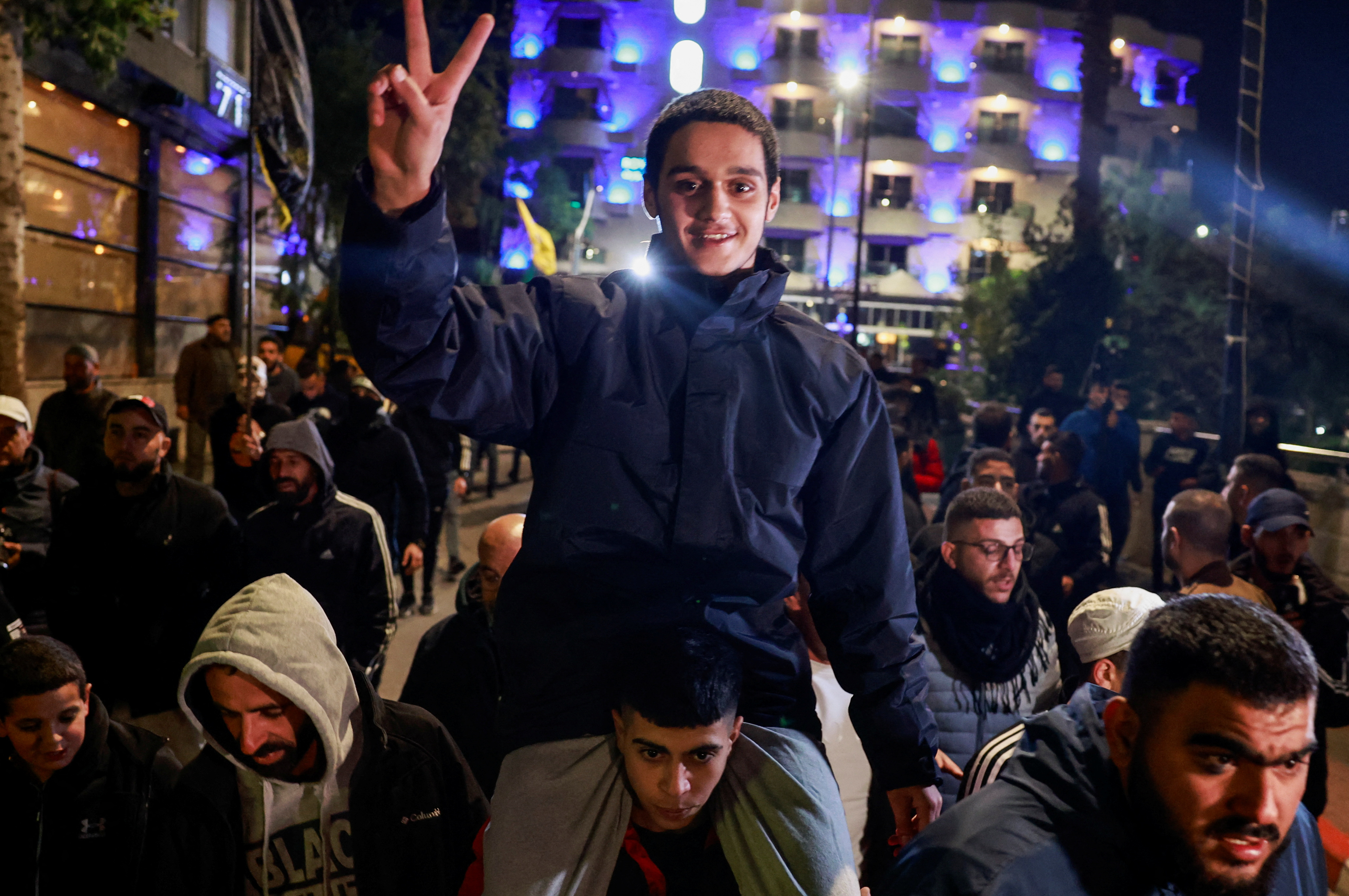 A Palestinian prisoner reacts after being released amid a hostages-prisoners swap deal between Hamas and Israel, in Ramallah, in the Israeli-occupied West Bank.
