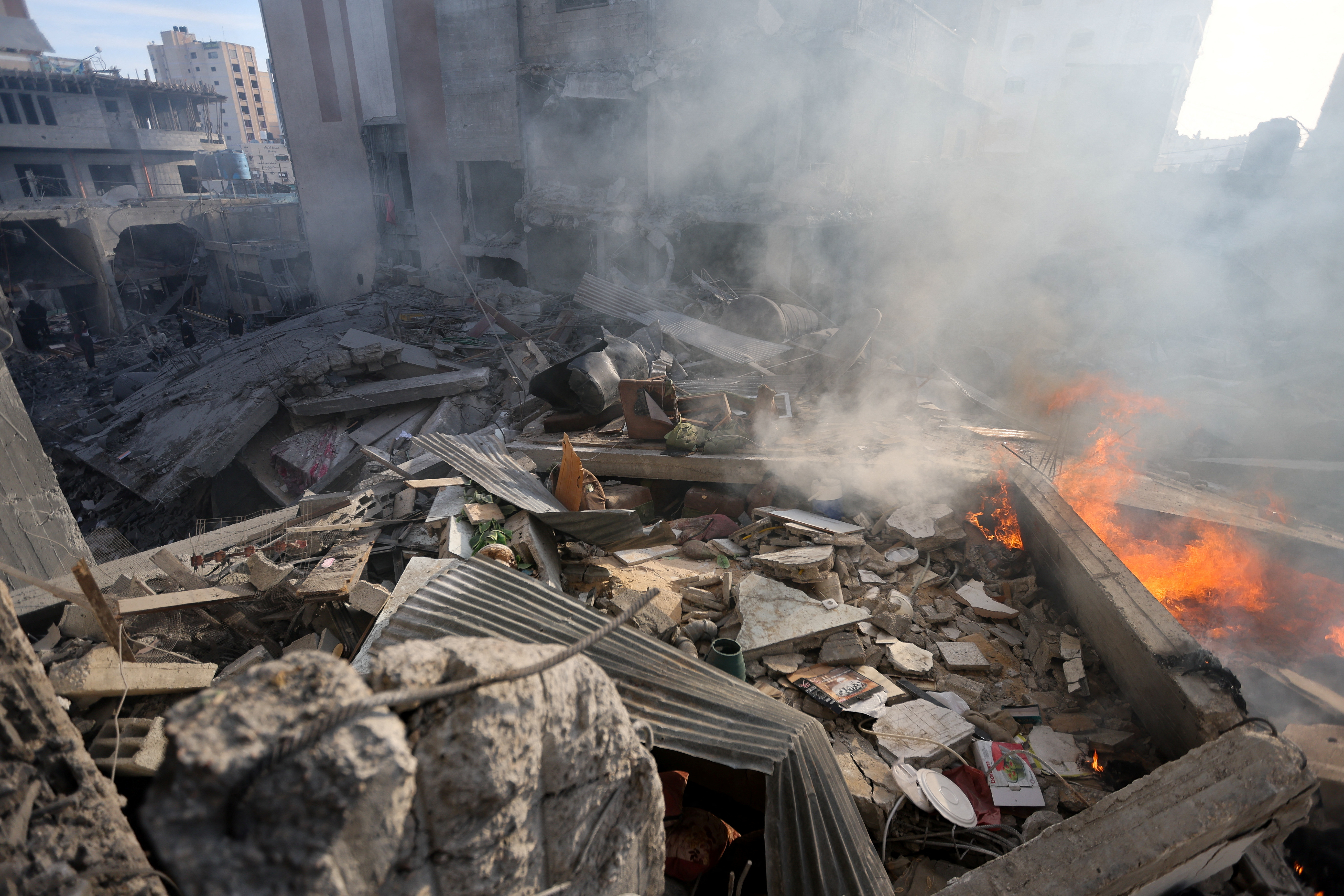 Smoke rises at the site of a house destroyed in an Israeli strike, amid the ongoing conflict between Israel and Hamas, in Khan Younis, in the southern Gaza Strip.