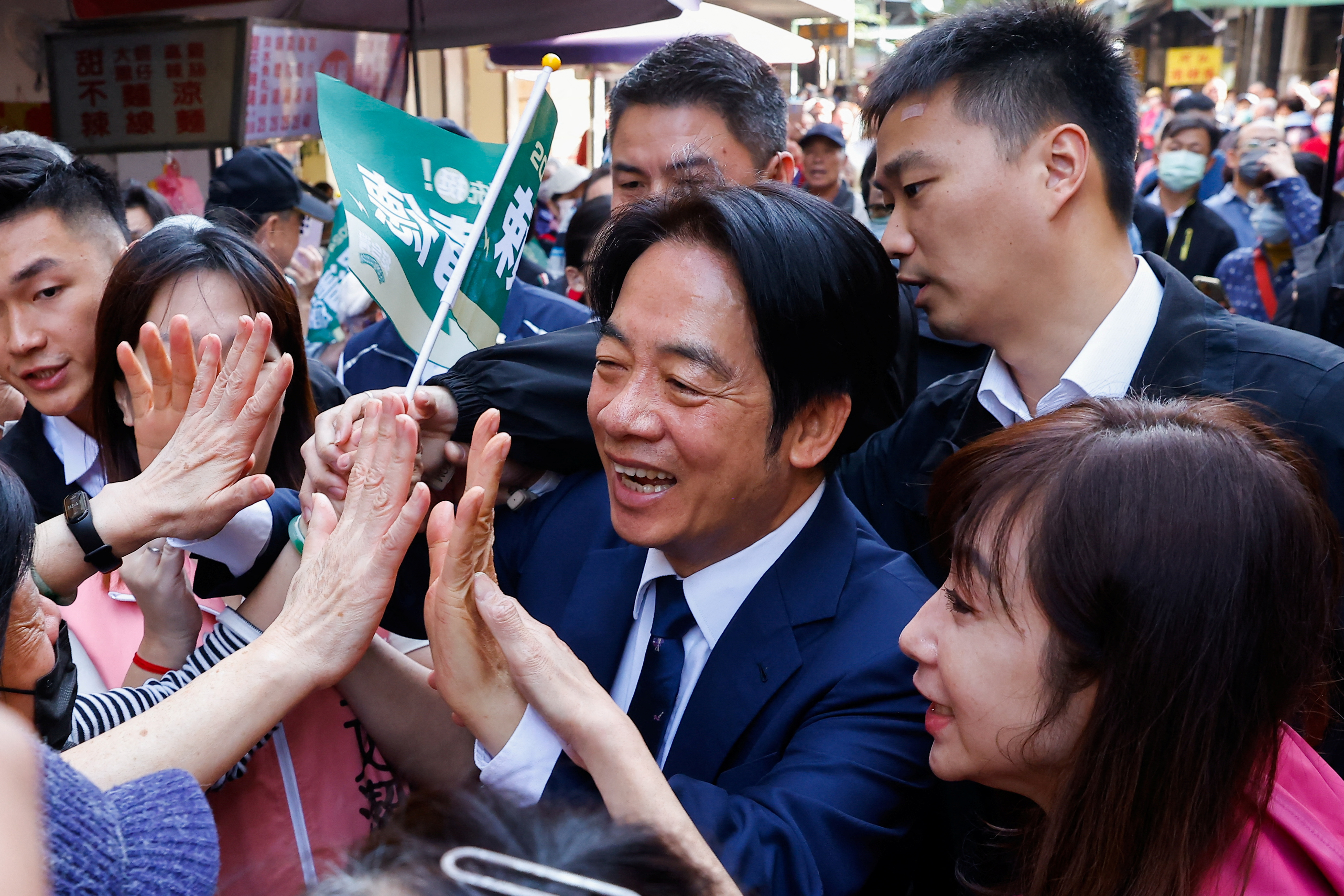 William Lai Ching-te, Taiwan's vice president and the ruling DPP presidential candidate. He is smiling and greeting supporters.