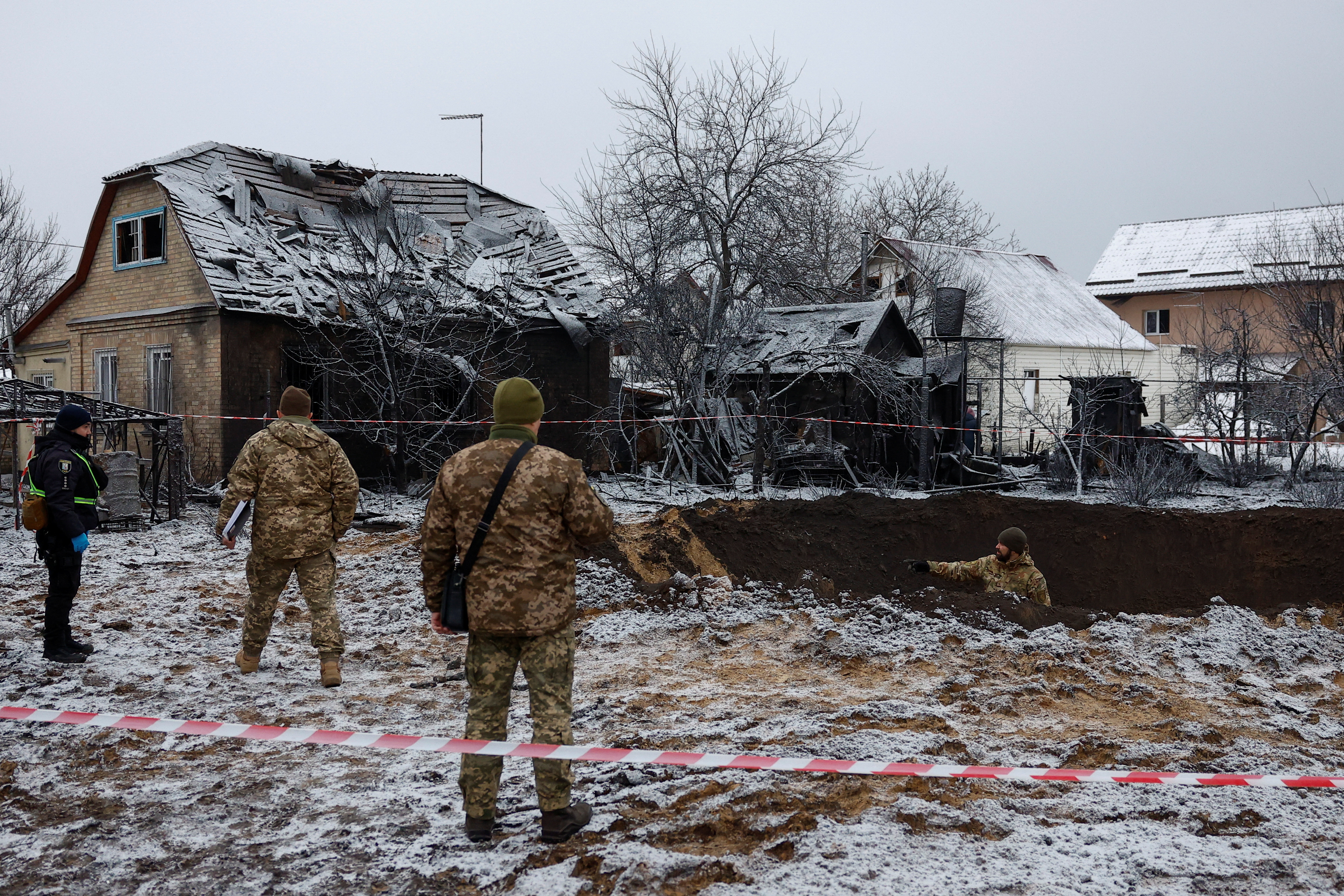Police inspect the site of a Russian missile strike in Kyiv, Ukraine, December 11 [Valentyn Ogirenko/Reuters]