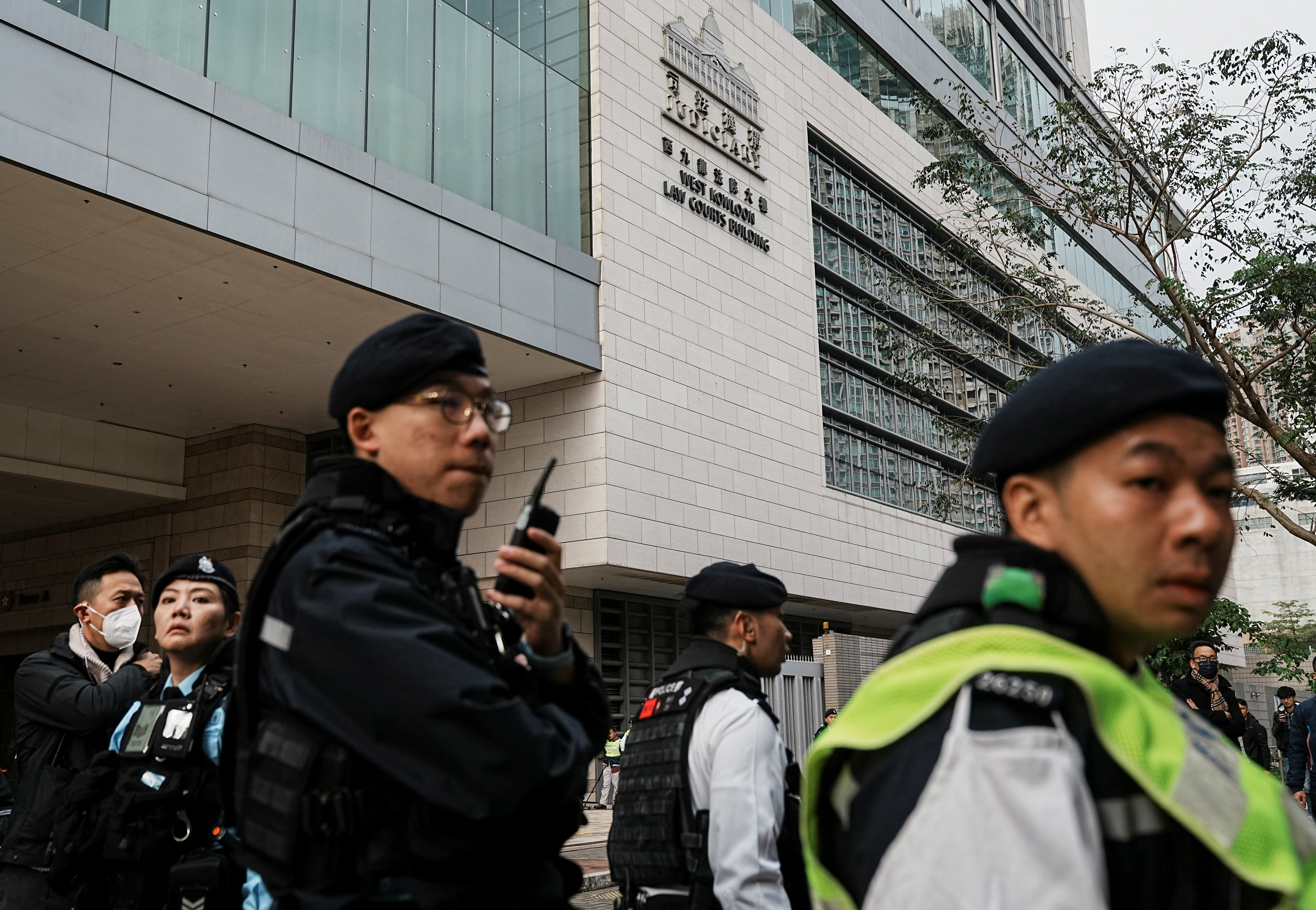 Police officers outside the court ahead of Jimmy Lai's trial
