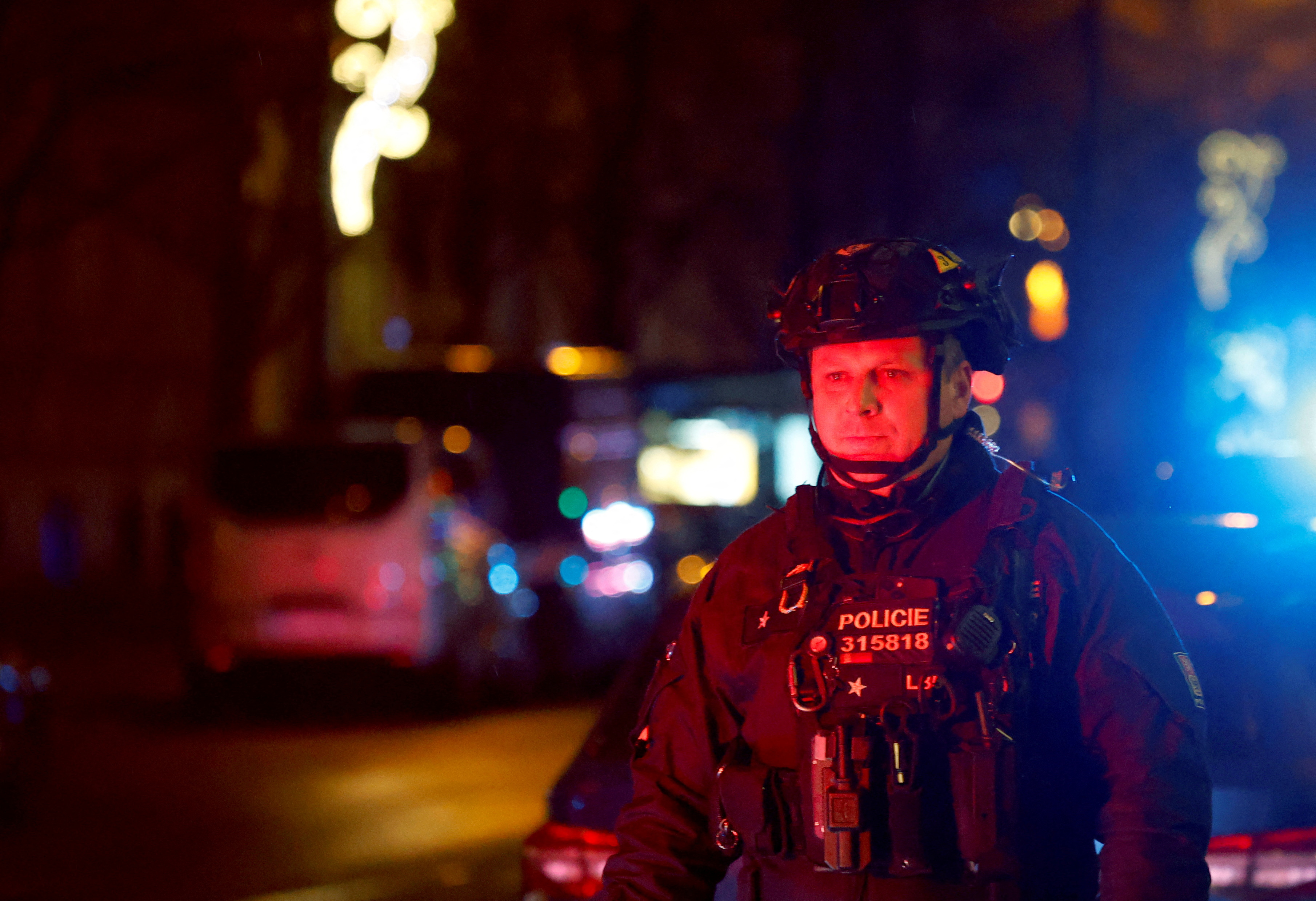 A police officer secures the area following the shooting at one of the buildings of Charles University in Prague, Czech Republic.
