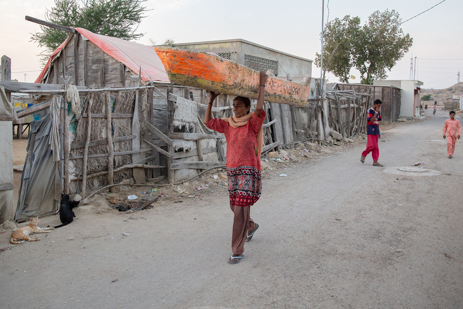 Hakku carries her boat to the water