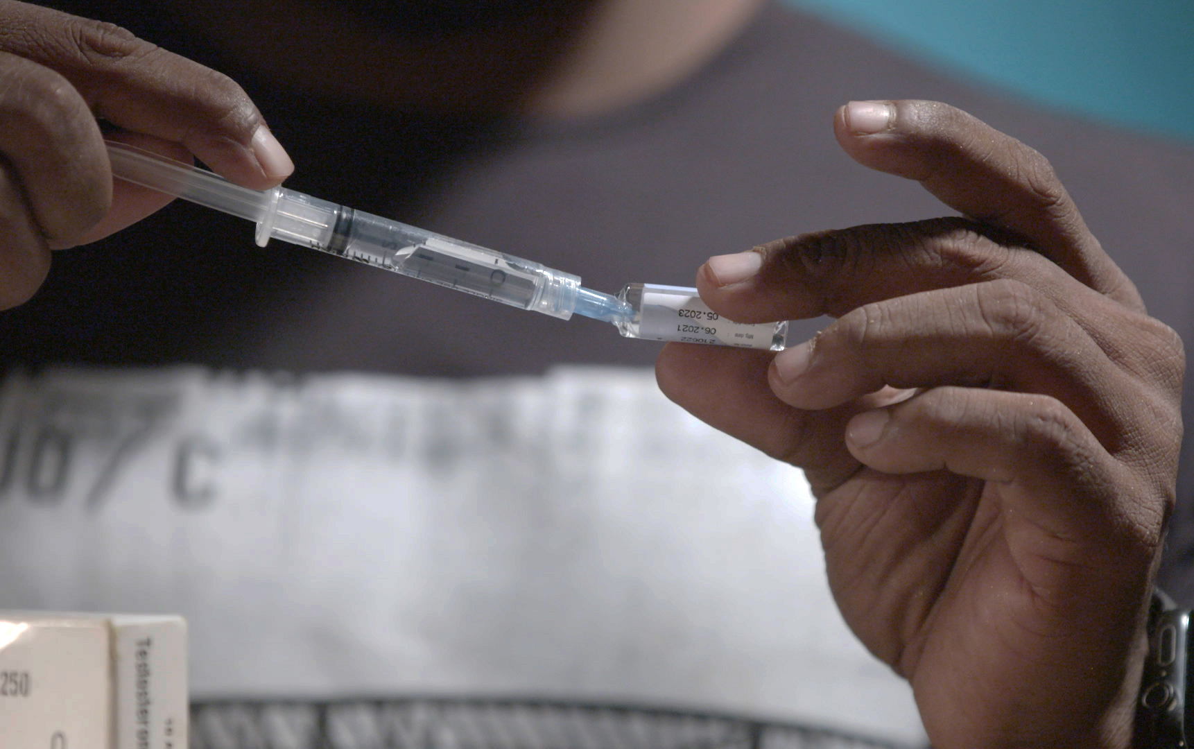 31. Images 31-32: Irfan injects his student with an anabolic steroid for muscle growth