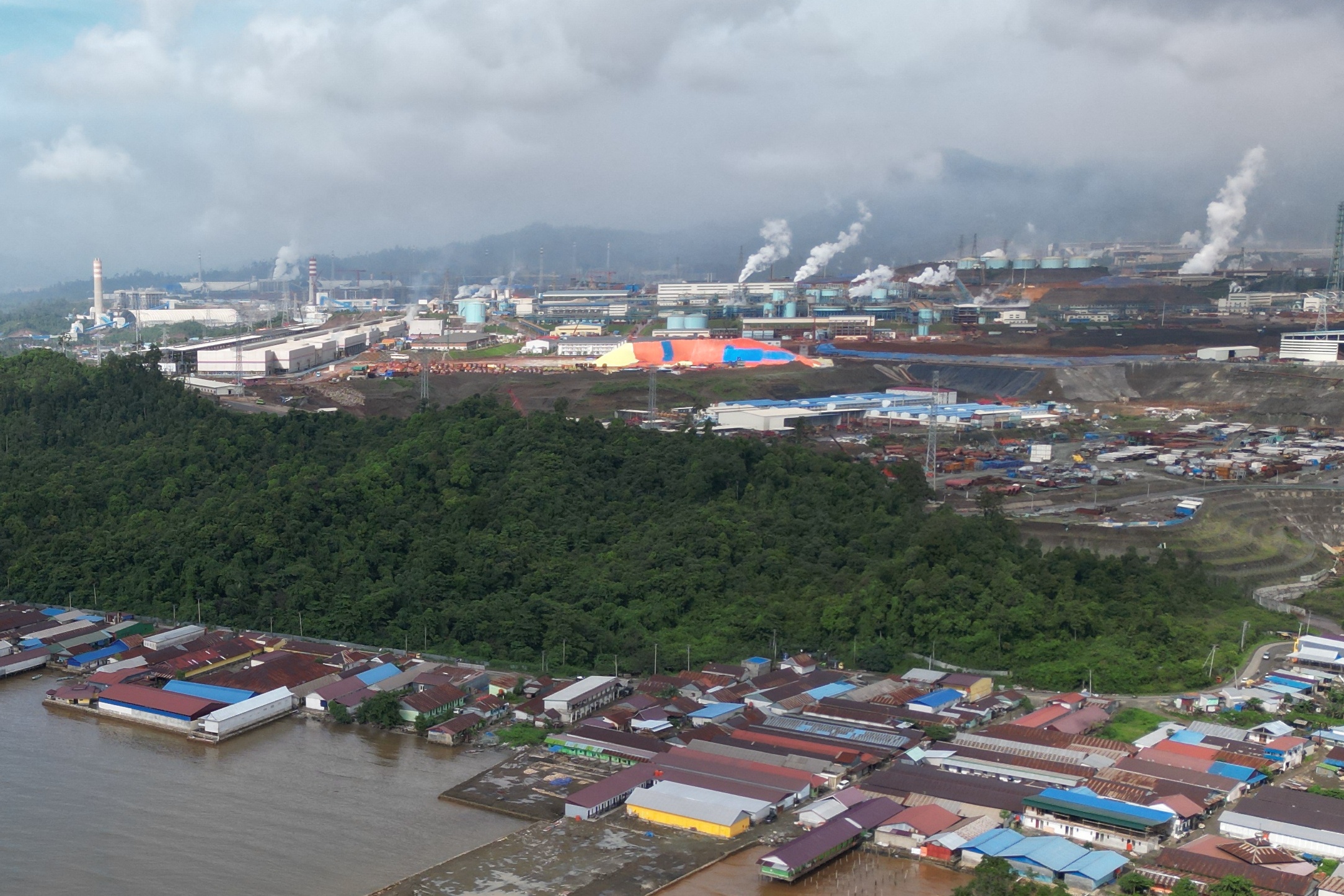 This aerial picture taken on May 12, 2023 shows a general view of PT. Indonesia Morowali Industrial Park (IMIP), one of the biggest nickel producers in Konawe Utara. (Photo by RIZA SALMAN / AFP)