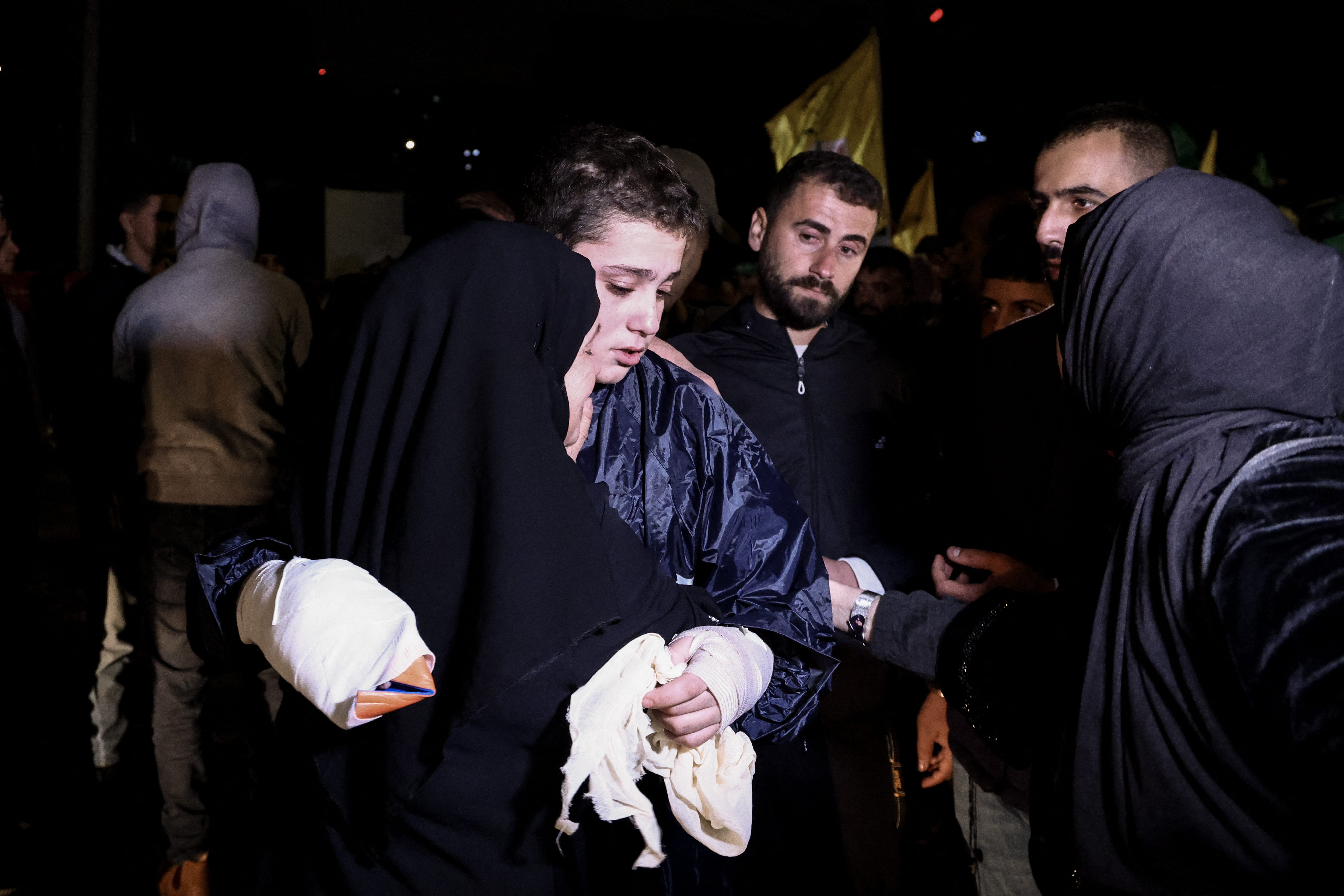 A Palestinian prisoner hugs his mother after being released from an Israeli jail in exchange for Israeli hostages released by Hamas from the Gaza Strip, in Ramallah in the occupied West Bank on November 28.