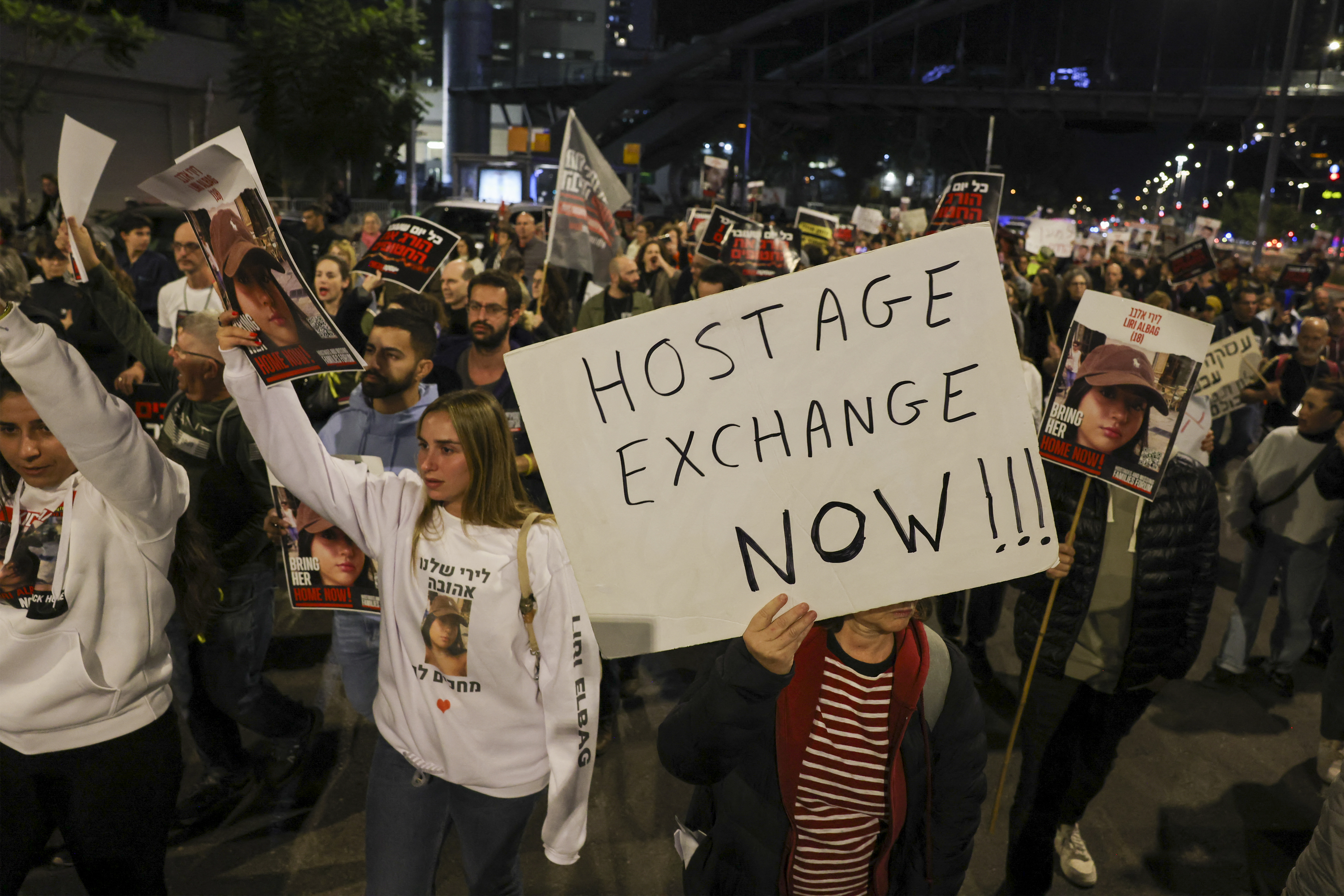 Families and supporters of hostages hostages held by Palestinian militants since the October 7 attack hold a demonstration outside the Israeli ministry of defence in Tel Aviv.