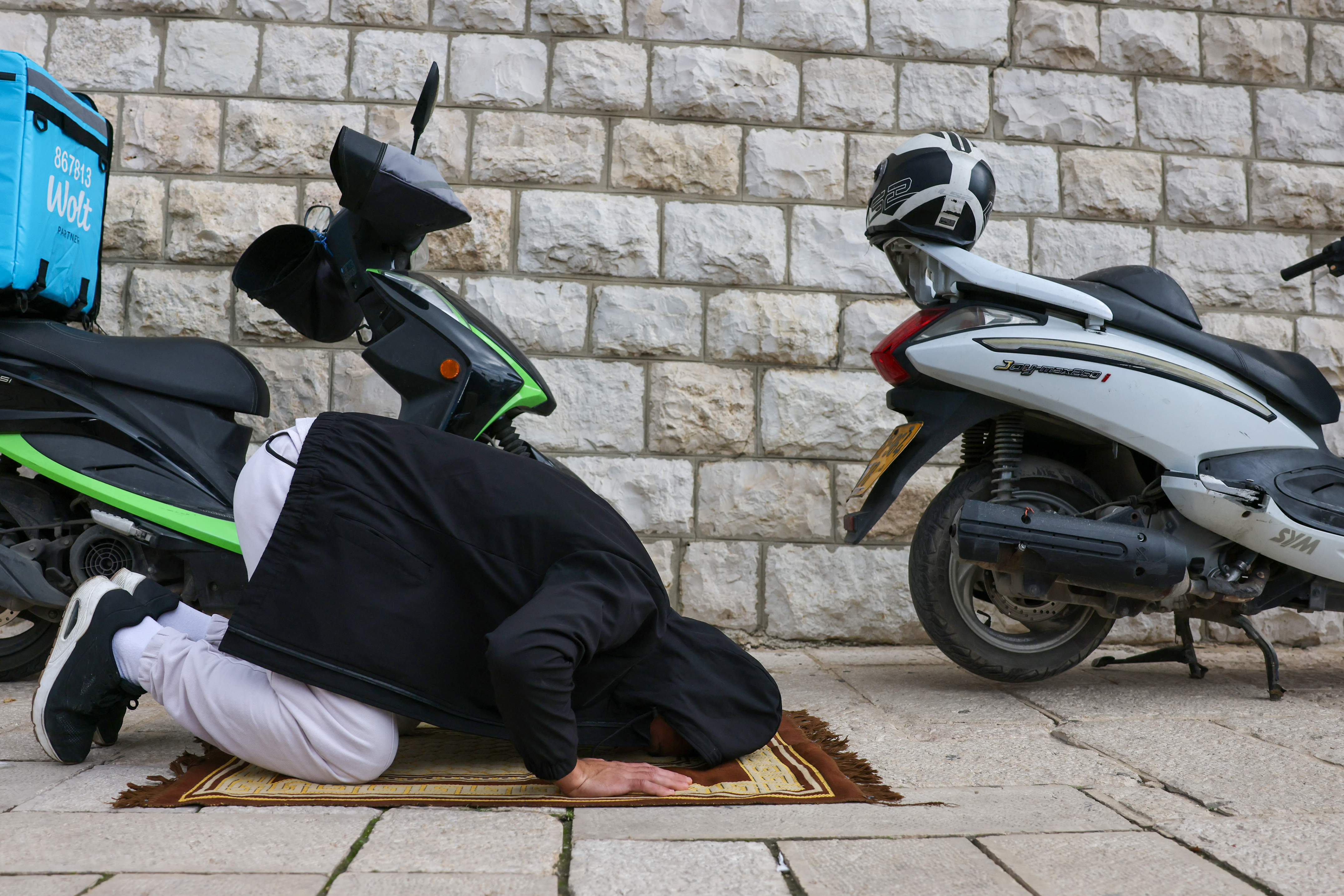 A Palestinian Muslim prays during Friday prayes in in east Jerusalem on December 29