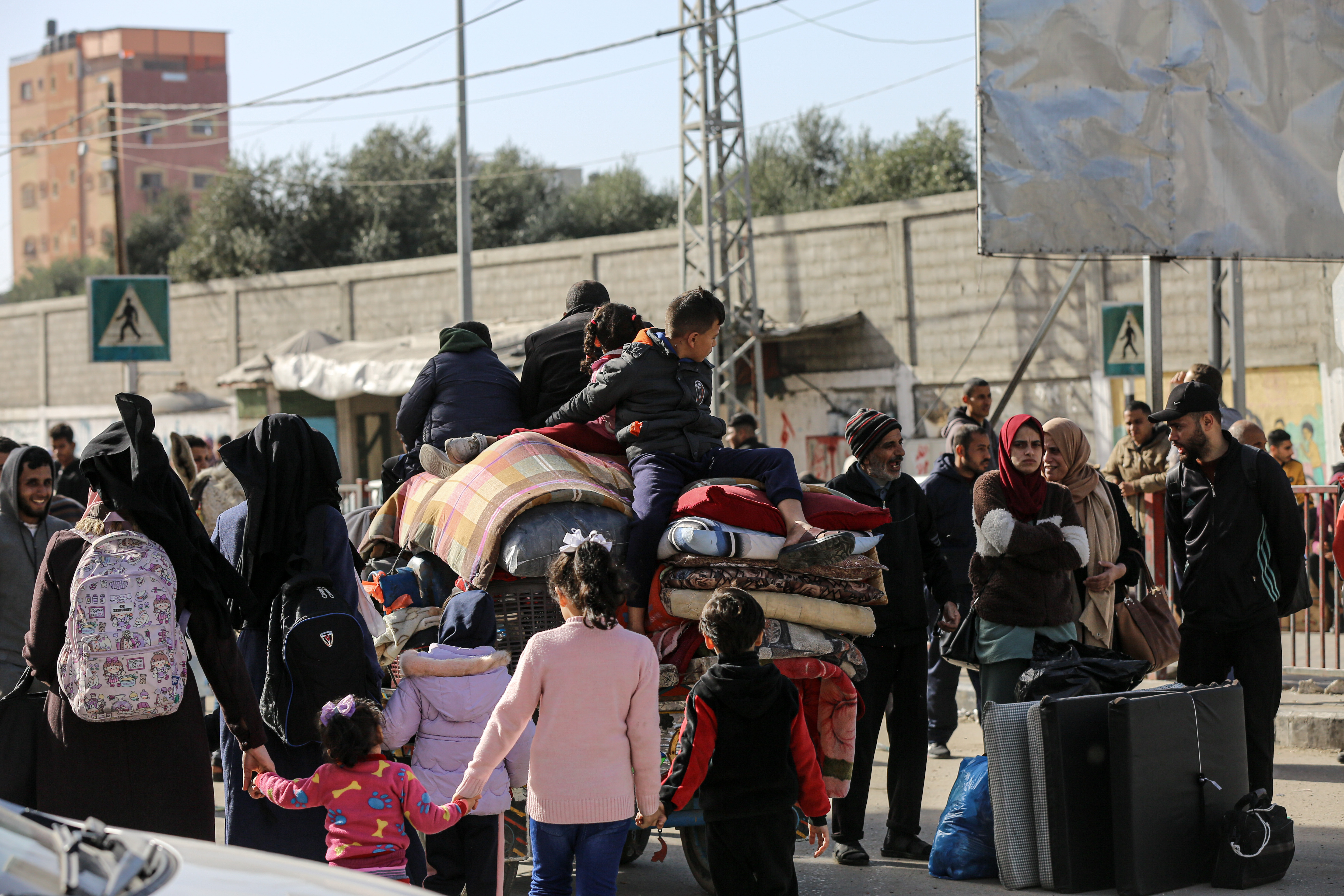 Palestinians flee their homes in Bureji refugee camp after Israeli order