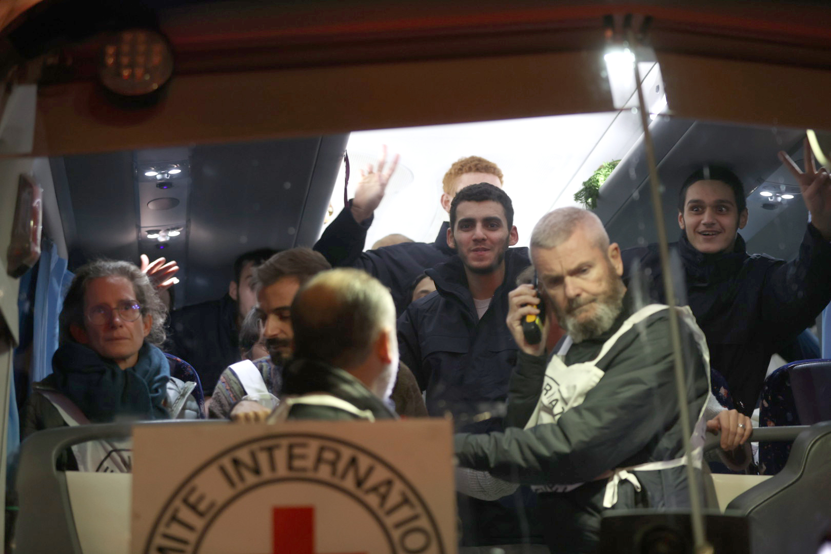 Palestinian hostages released from Israeli jails arrive in Beitunia, West Bank by a bus belonging to the International Committee of the Red Cross (ICRC).