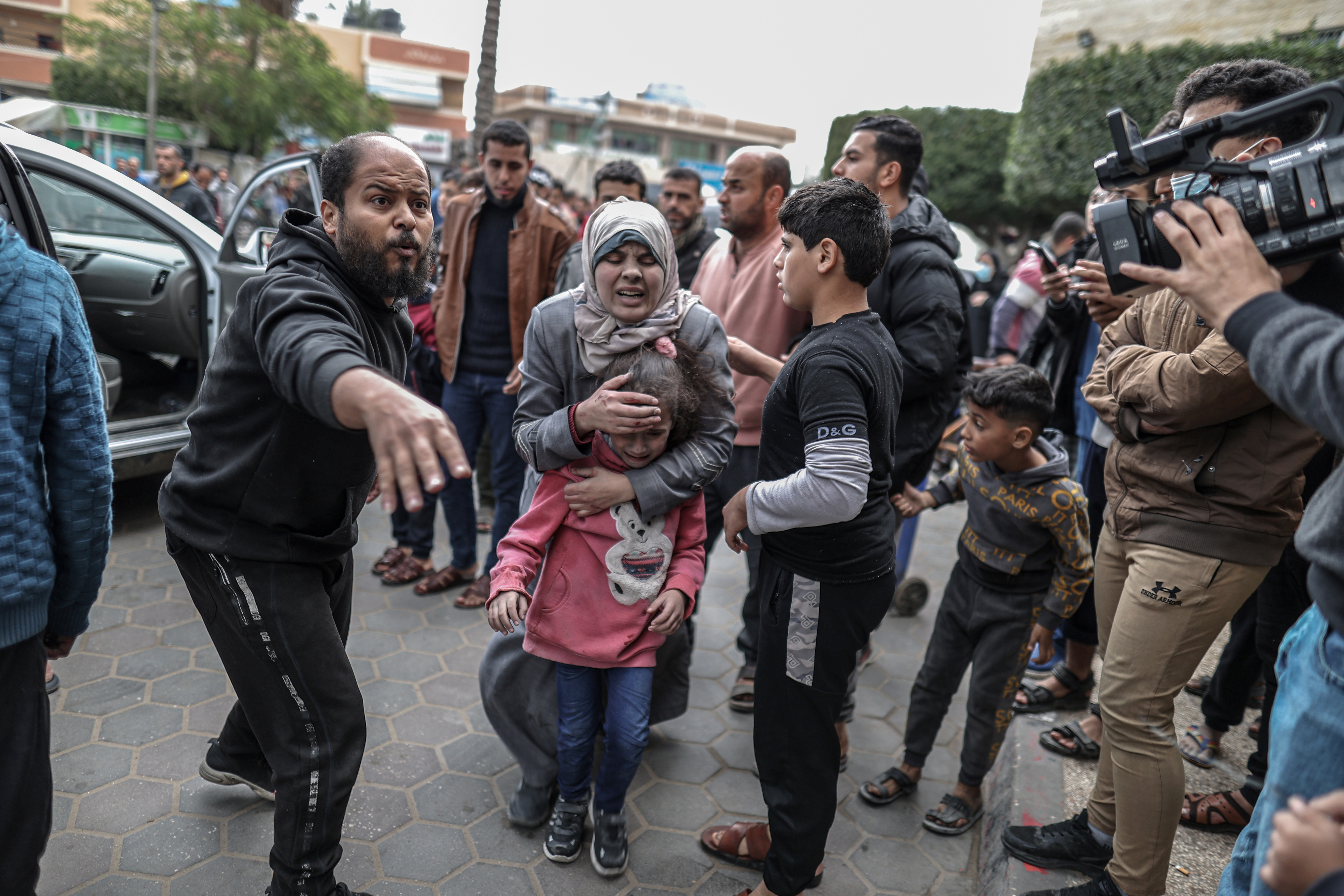 Palestinian children injured in Israeli attacks are brought to Al-Aqsa Martyrs Hospital in Deir al Balah