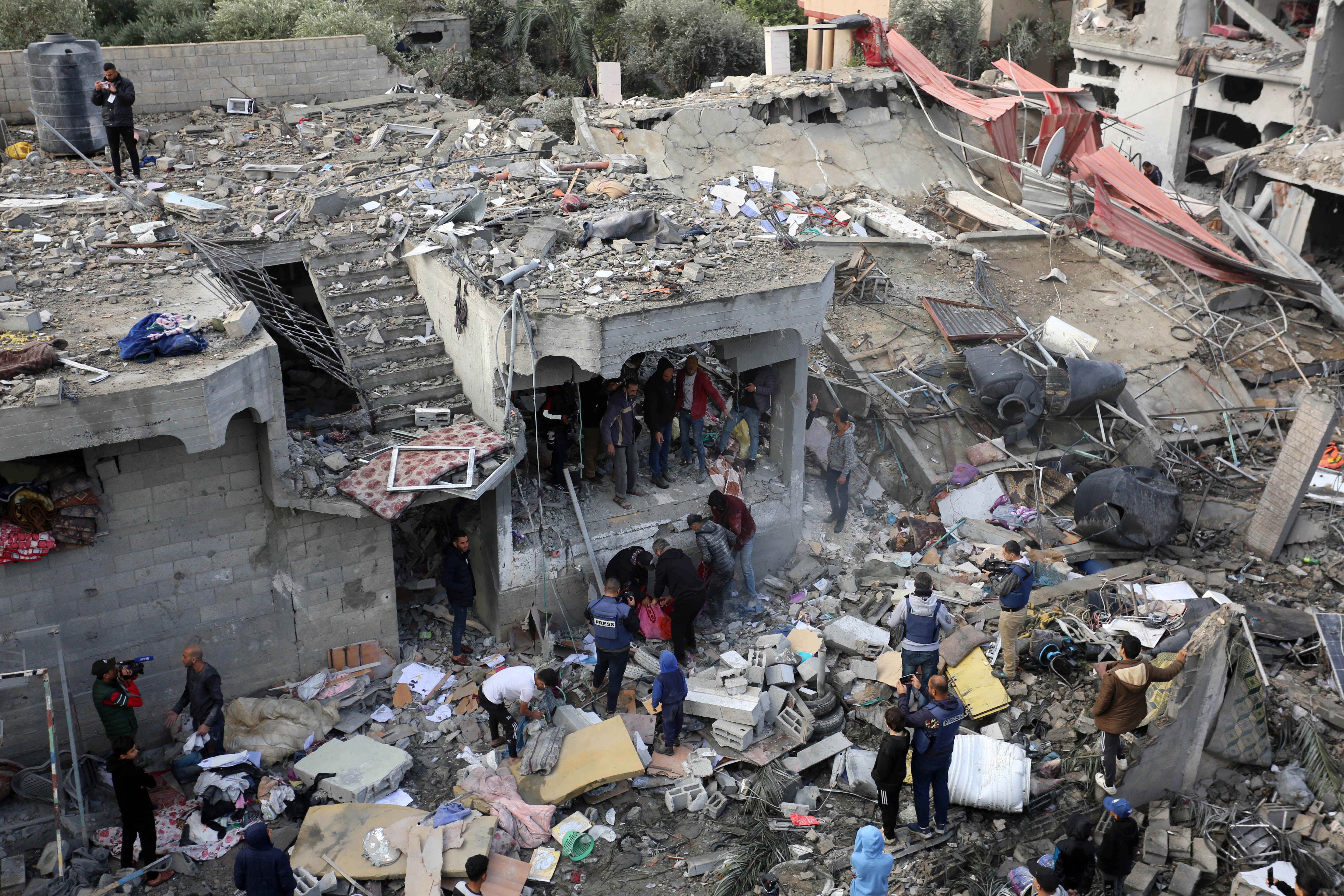 Search and rescue efforts for those trapped under rubble continue after Israeli airstrike hit civil residential area in al Maghazi refugee camp, Gaza on December 25