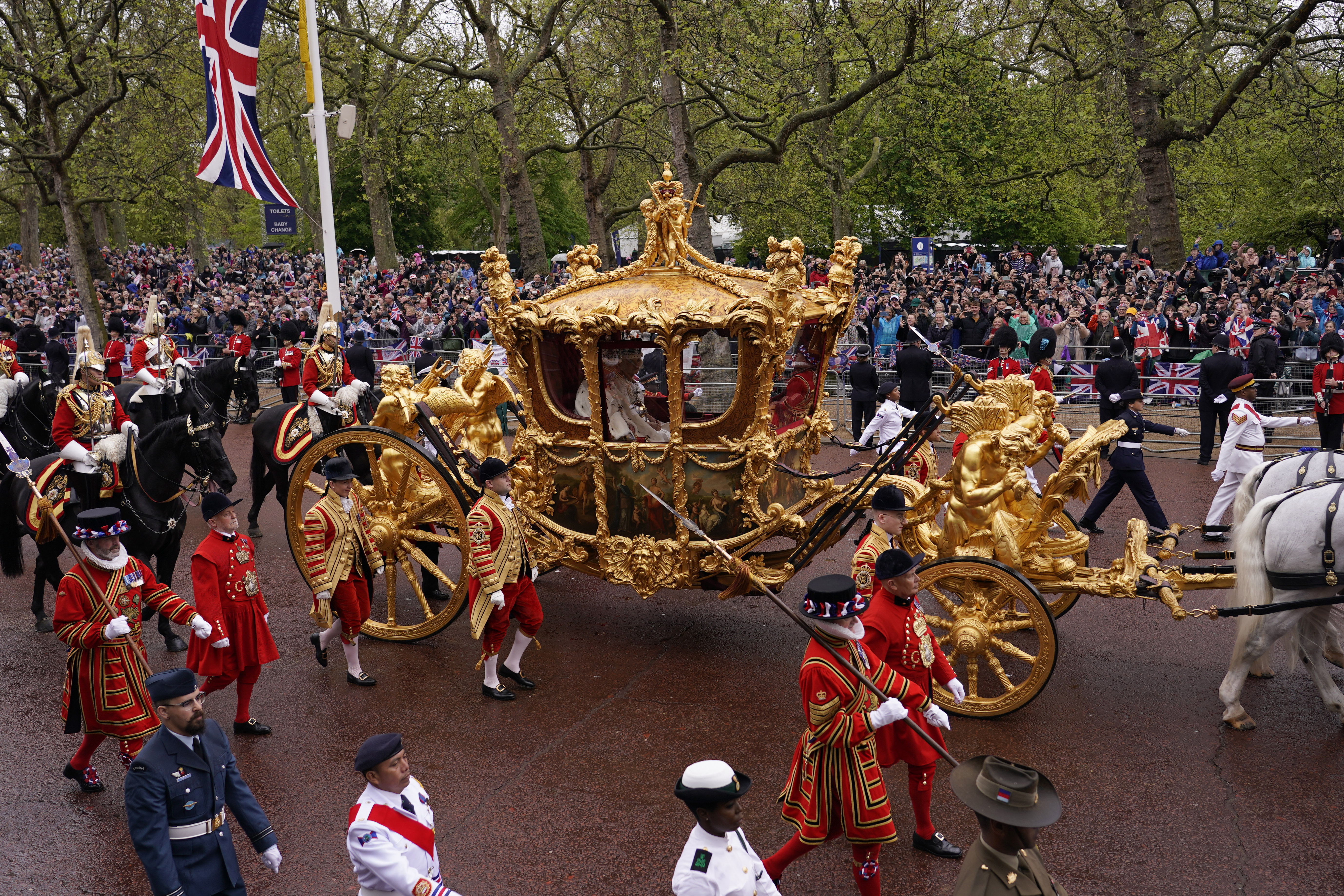 Britain's King Charles III and Queen Camilla travel in the Gold State Coach from Westminster Abbey to Buckingham Palace