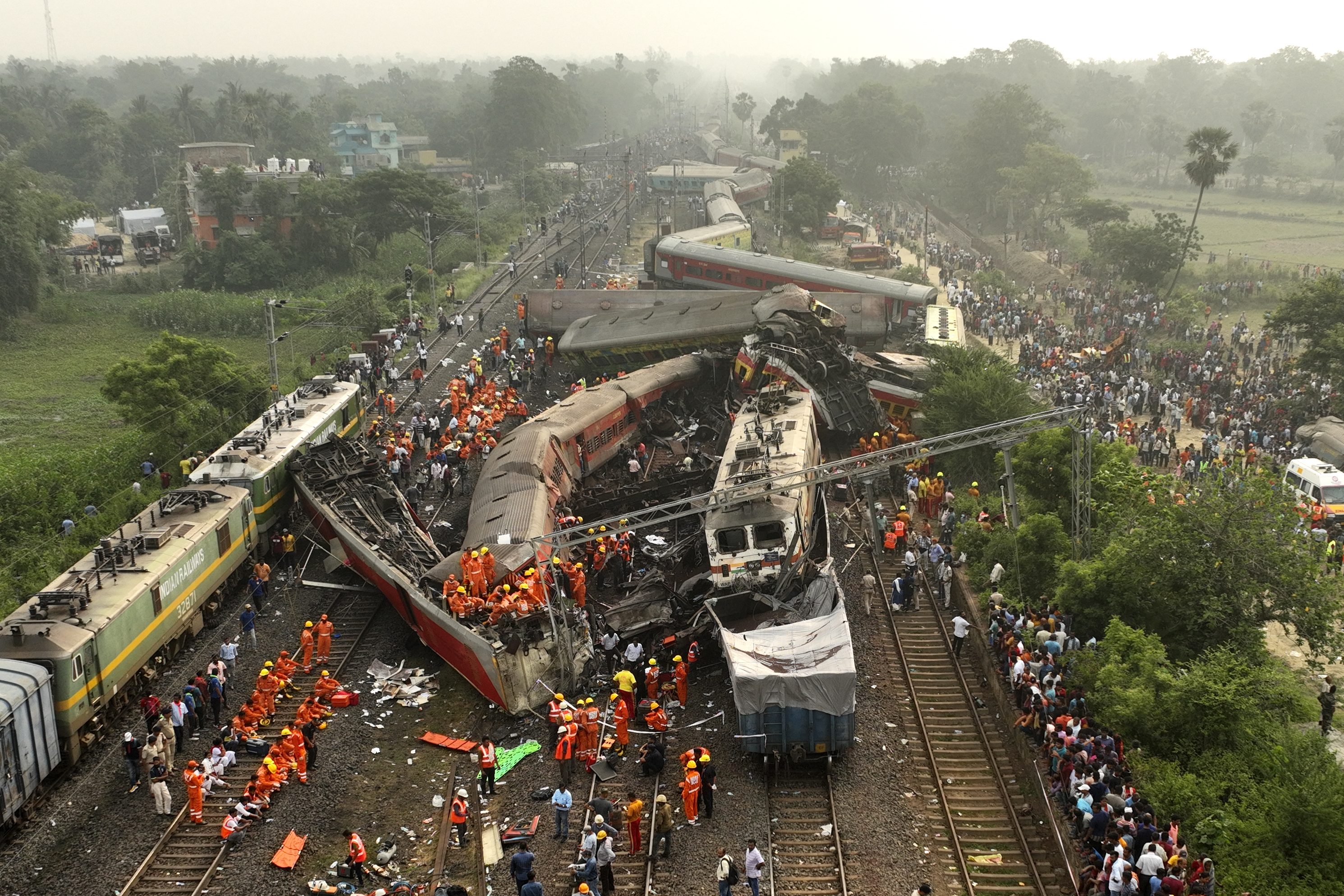 A drone shot of rescuers work at the site of passenger trains accident, in Balasore district, in the eastern Indian state of Orissa, Saturday, June 3, 2023