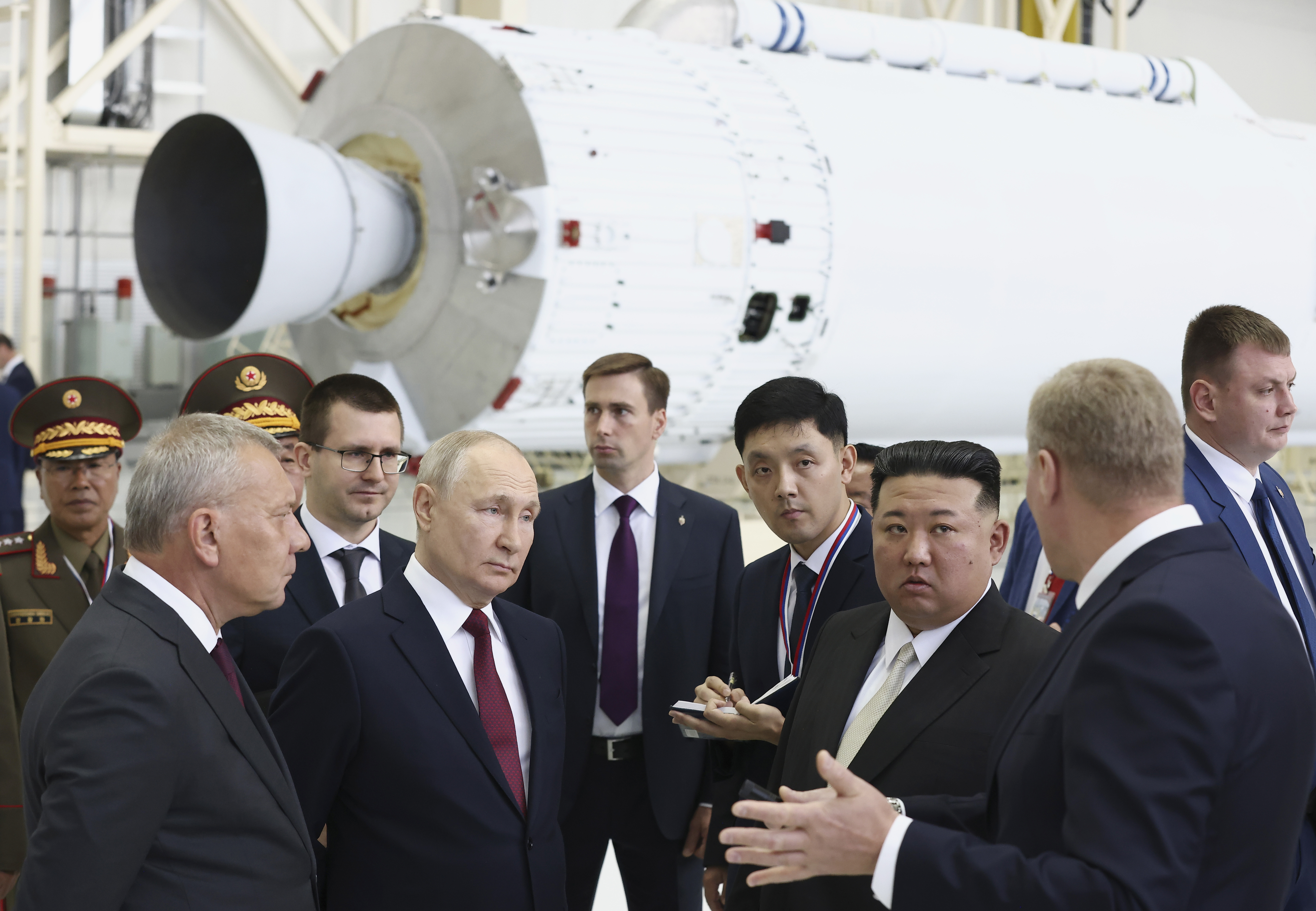 Russian President Vladimir Putin and North Korea's leader Kim Jong Un examine a rocket assembly hangar during their meeting at the Vostochny cosmodrome outside the city of Tsiolkovsky, about 200 kilometers (125 miles) from the city of Blagoveshchensk in the far eastern Amur region, Russia, on Wednesday, Sept. 13