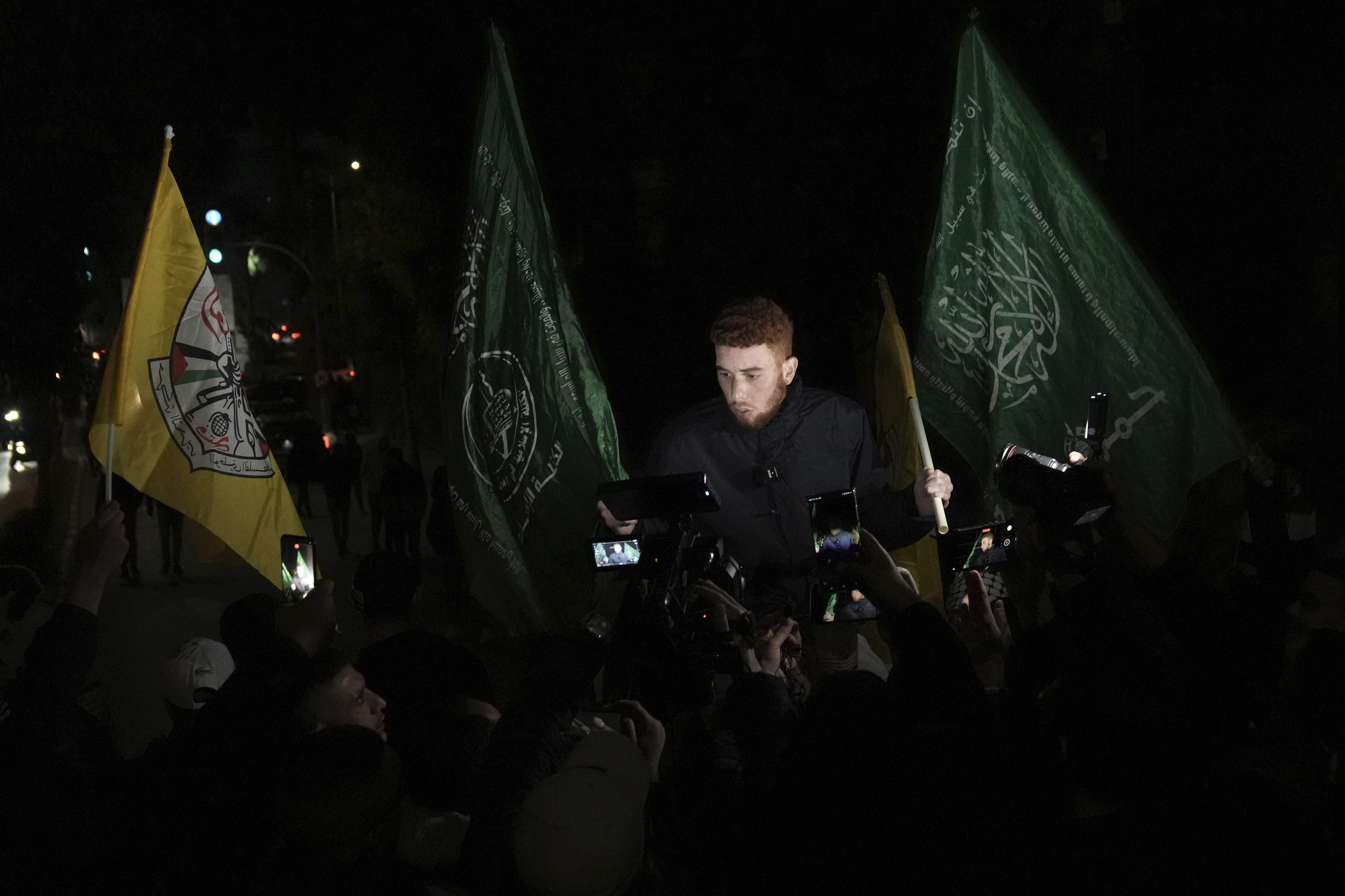 A Palestinian man is carried on shoulders after being released from prison by Israel.