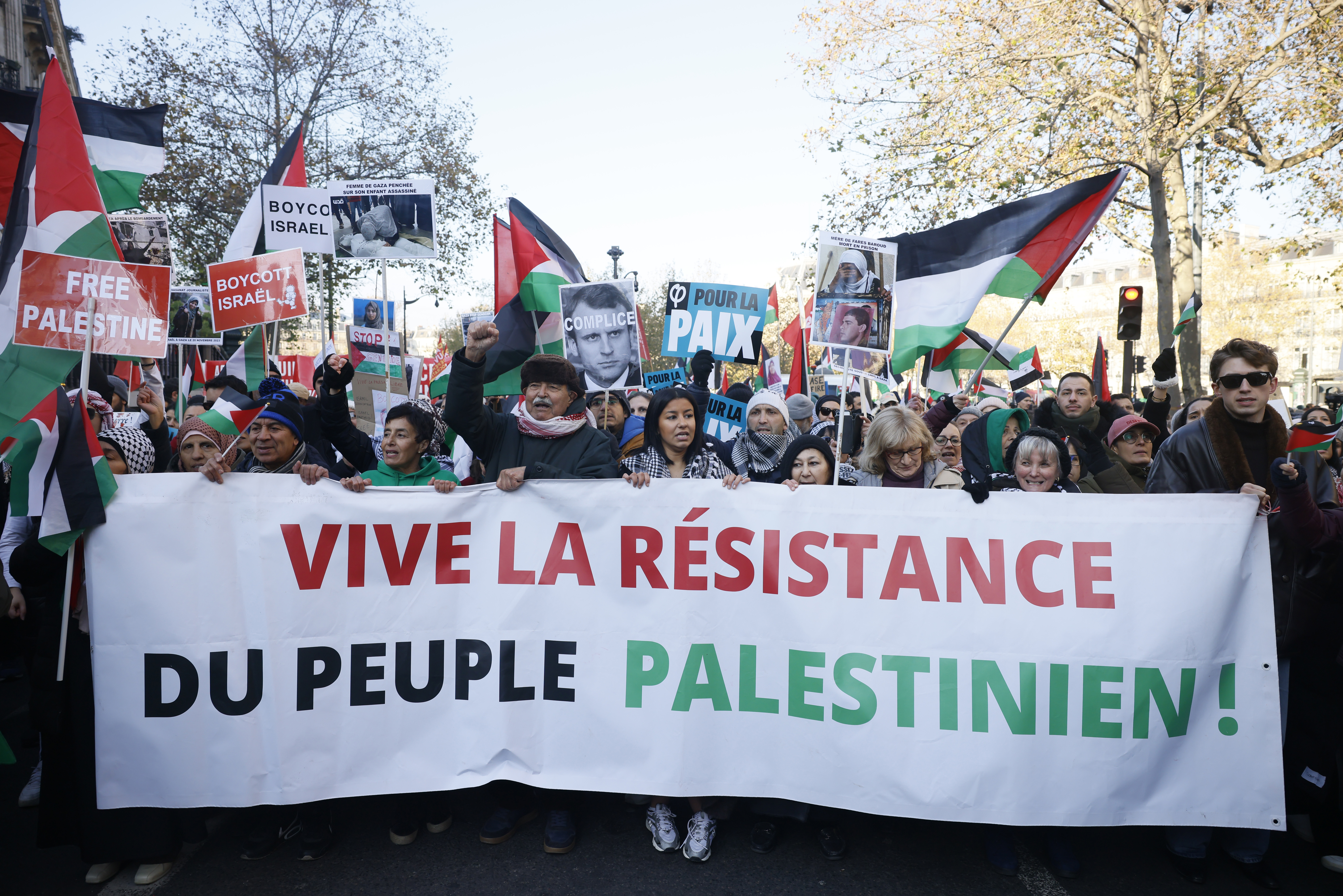 People chant slogans holding banners that reads « Long live the resistance of the Palestinian people" during a pro-Palestinian rally, in Paris, Saturday, Dec. 2