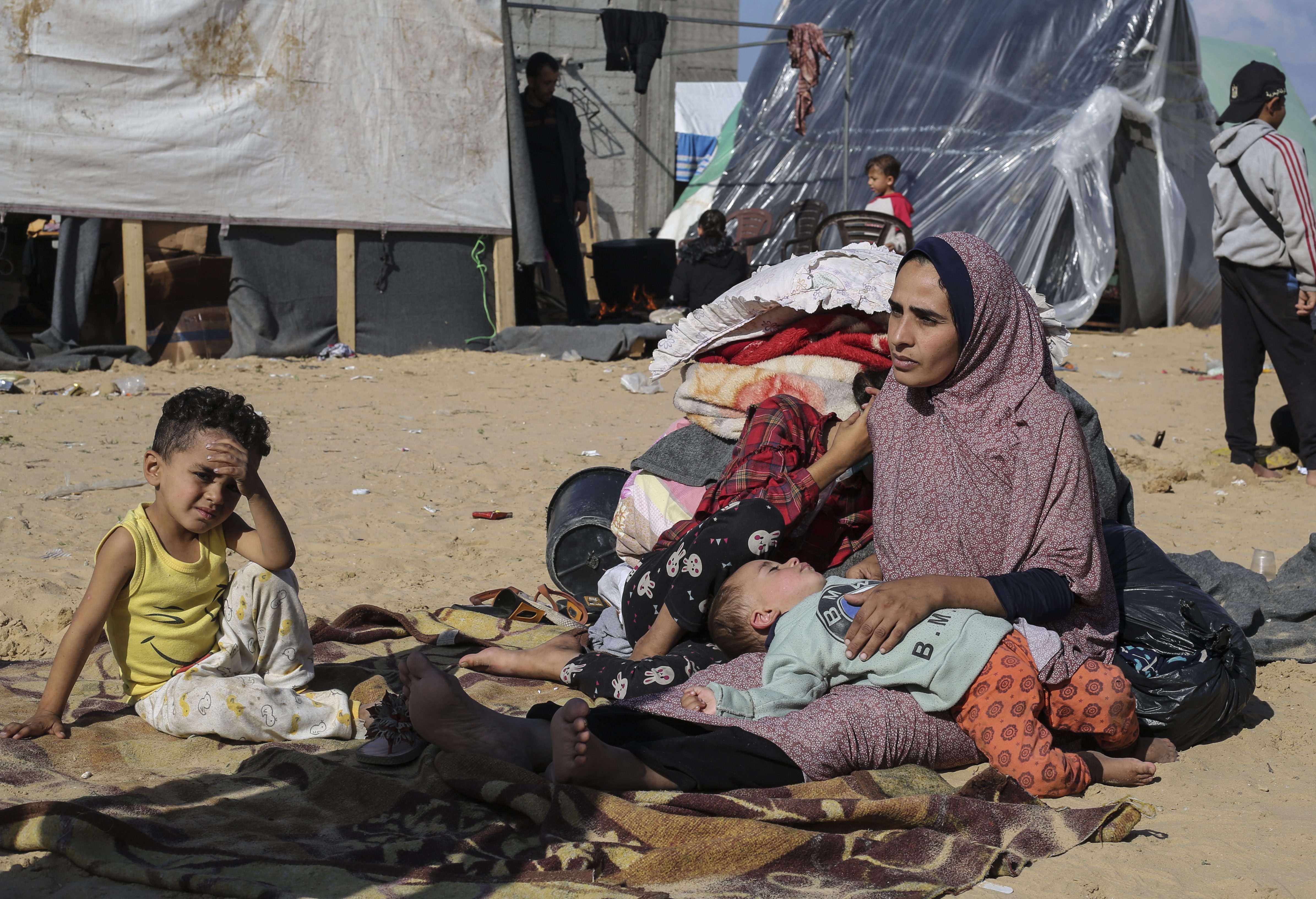 Palestinians displaced by the Israeli bombardment of the Gaza Strip set up a tent camp in Rafah
