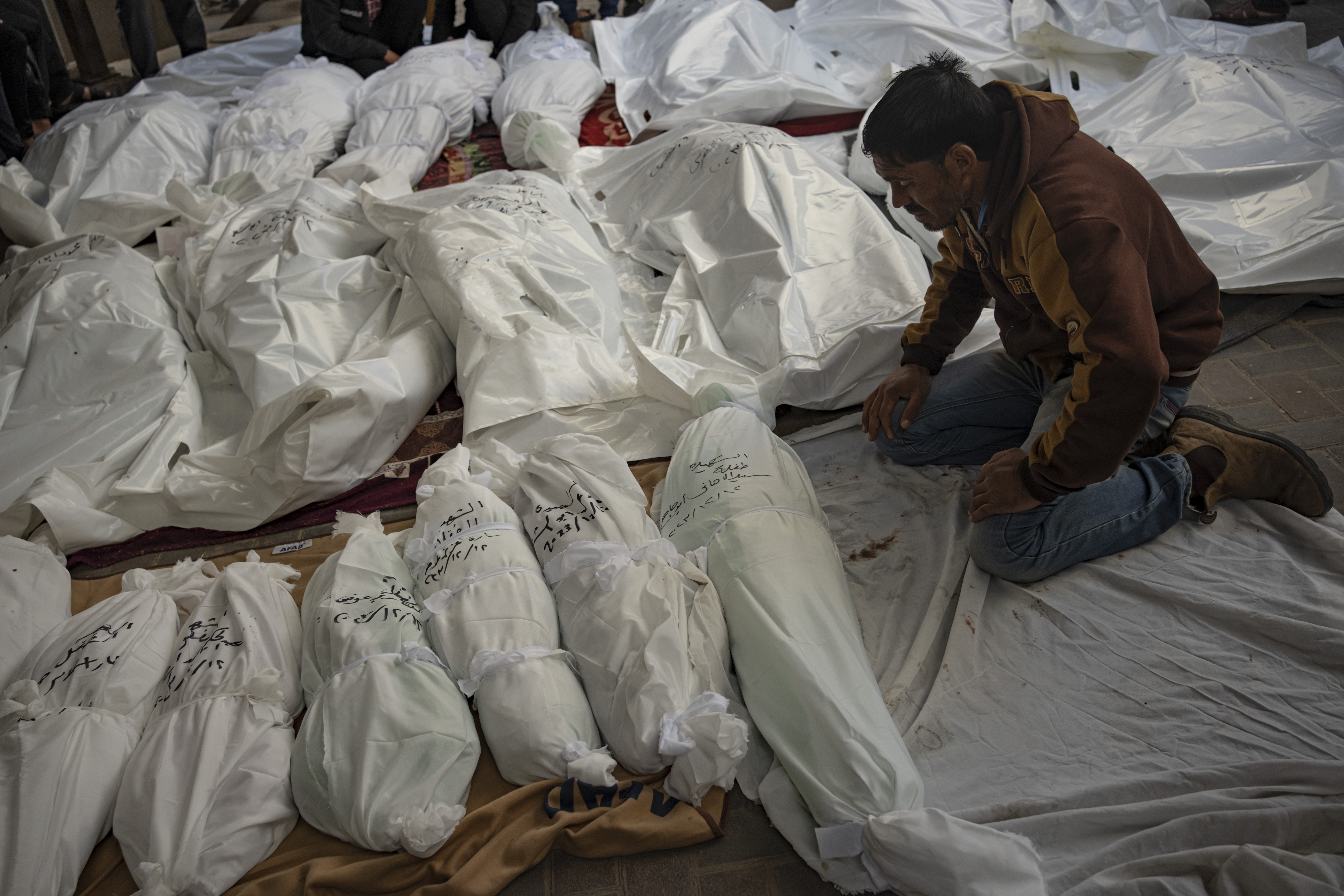 Palestinians mourn their relatives killed in the Israeli bombardment of the Gaza Strip, at the hospital Rafah