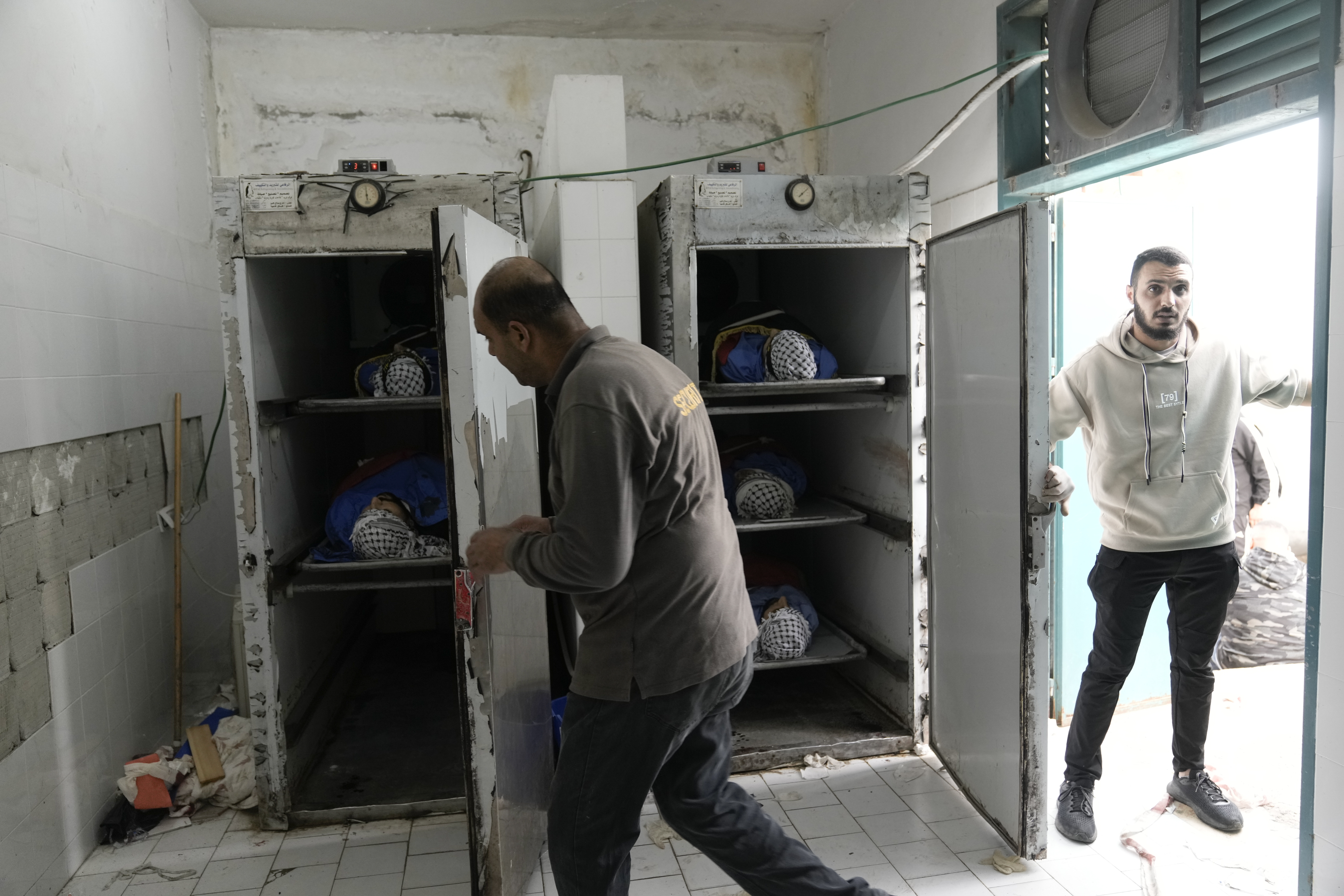 Palestinian militants killed during Israeli military raid on Nur Shams refugee camp lie in a morgue in Tulkarem, West Bank, on Sunday