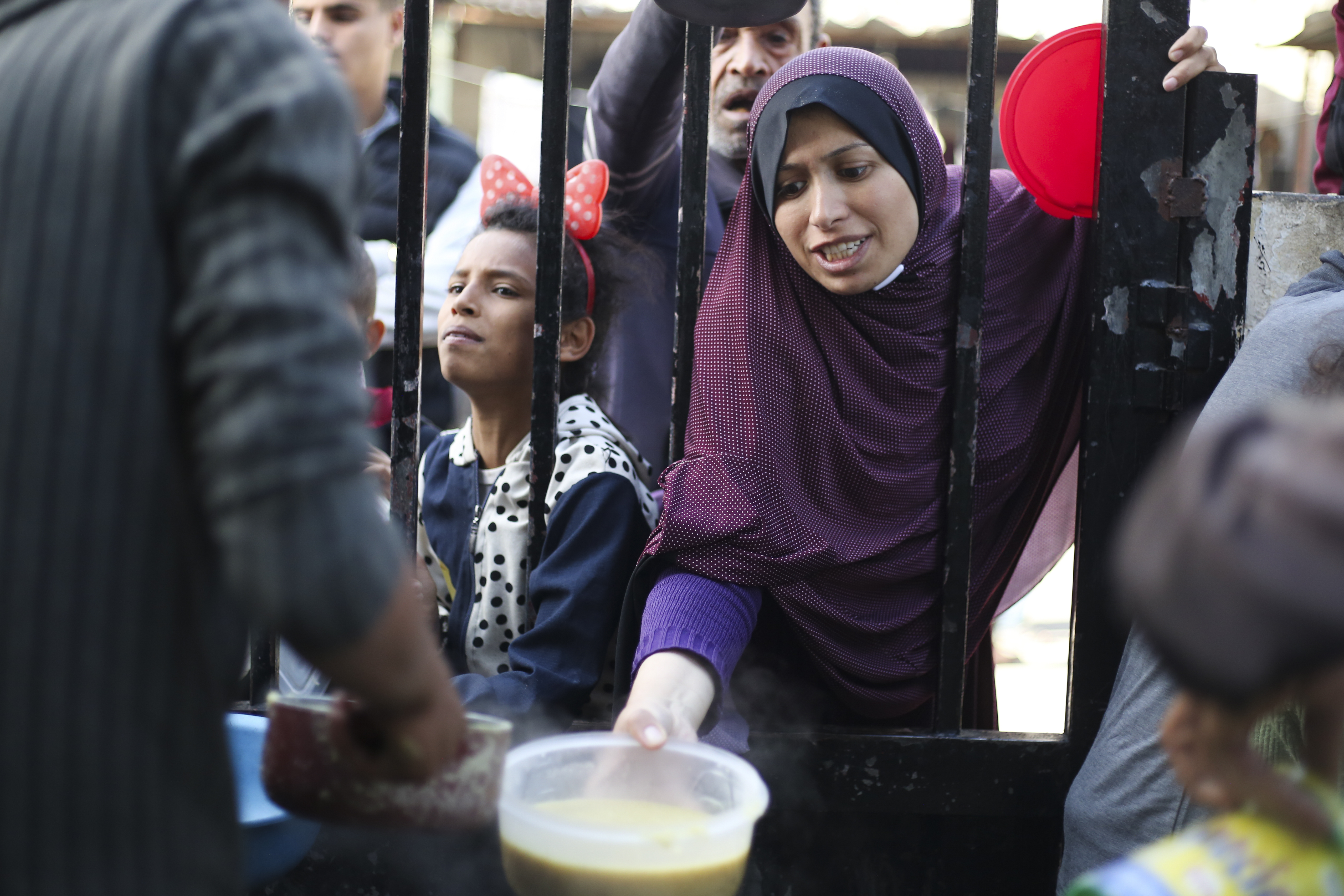Palestinians line up for a free meal in Rafah, Gaza Strip.