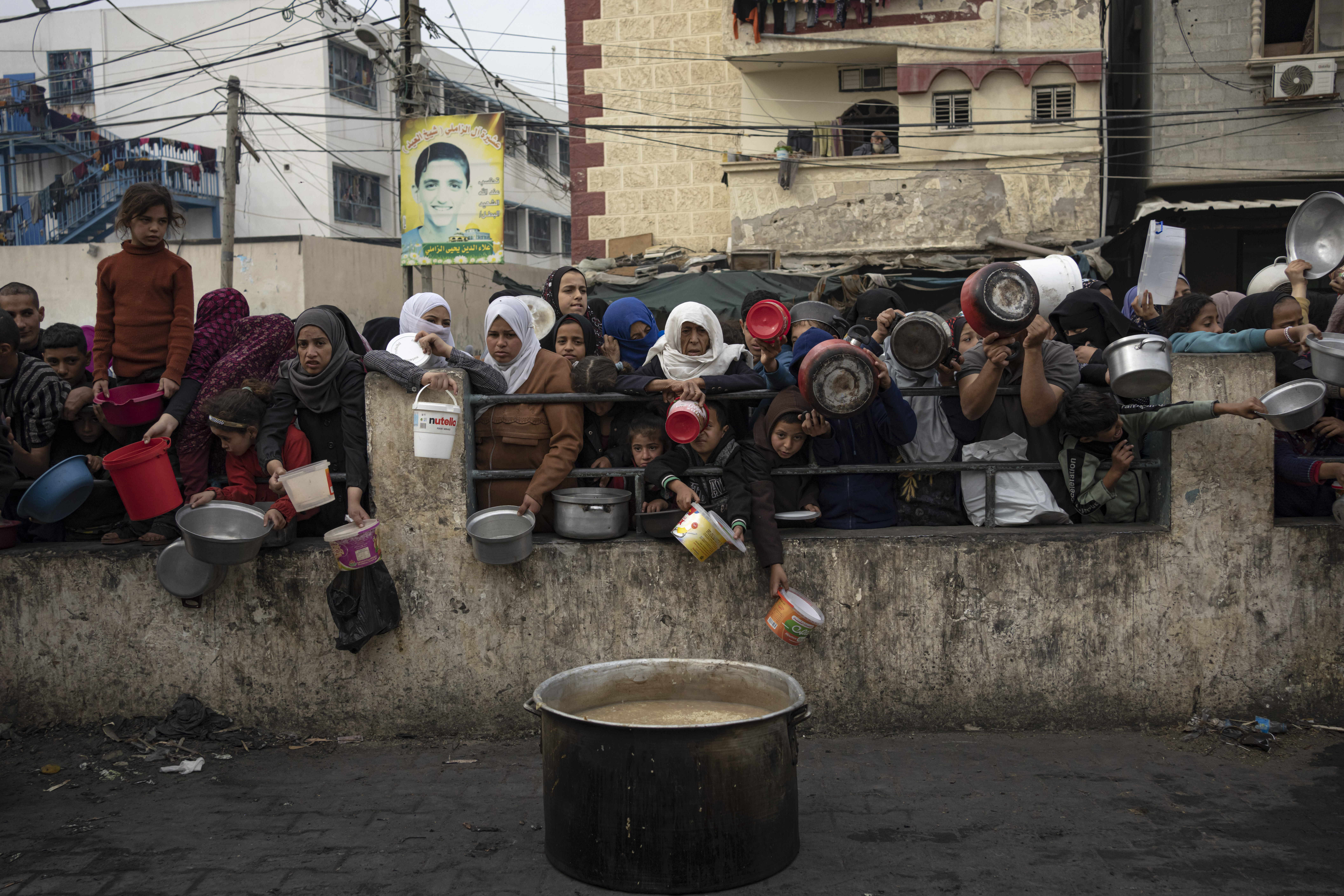 Palestinians line up for a free meal in Rafah, Gaza Strip.