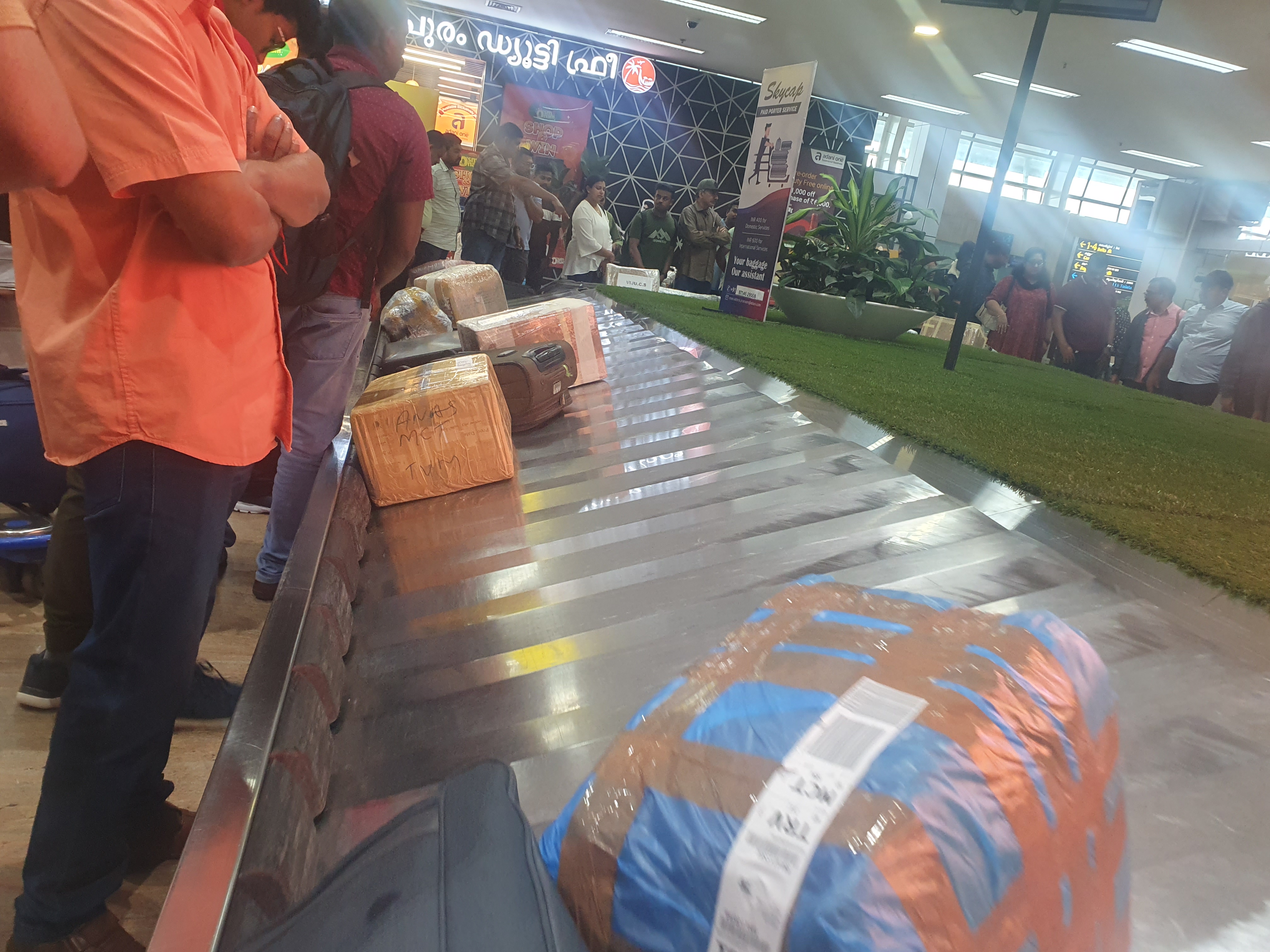 Brown cartons moving along with other suitcases from Bahrain on the conveyor belt at Thiruvananthapuram International Airport on October 31