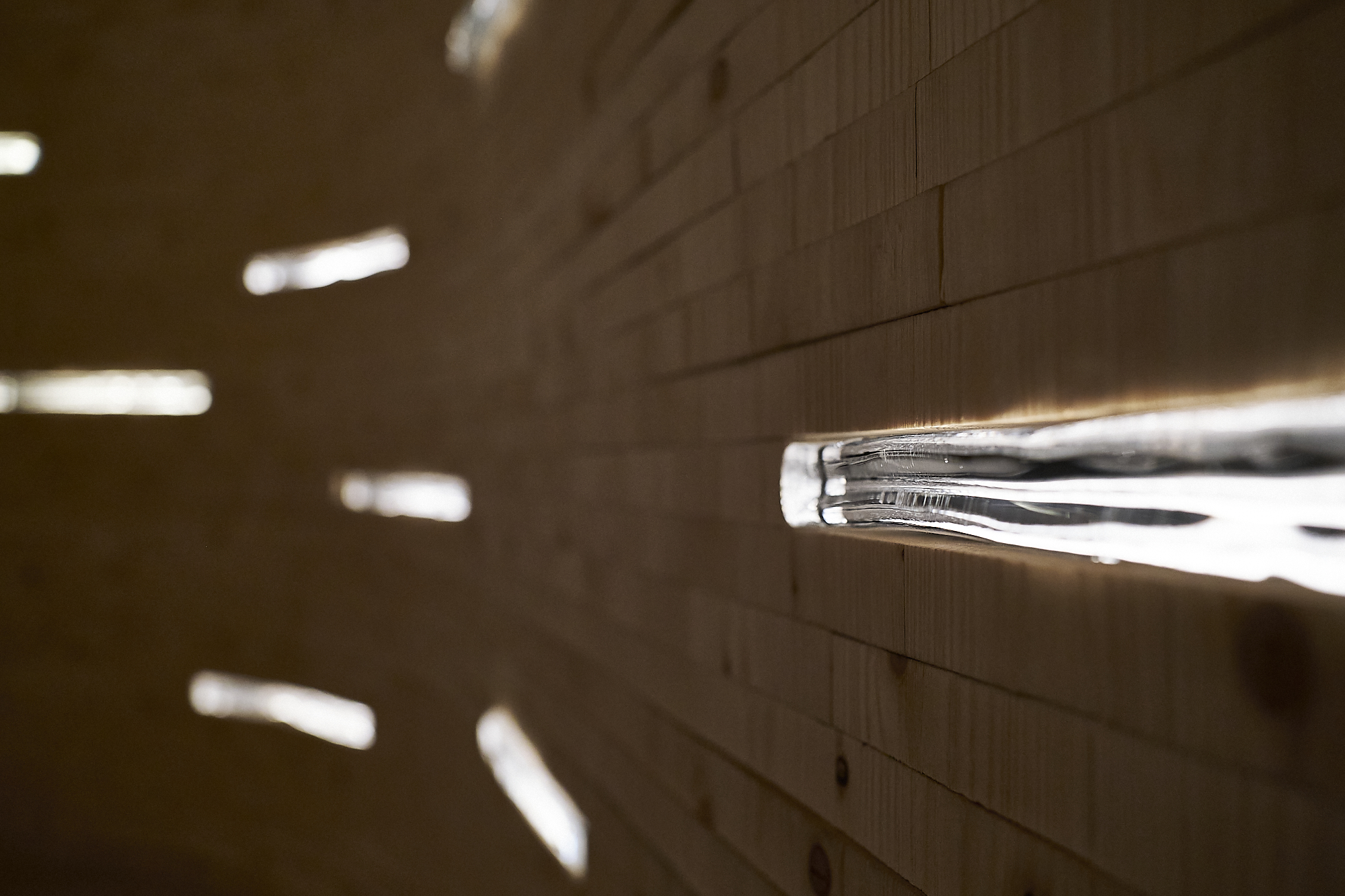 Manuscripts are slotted into the walls of the Silent Room [Anna Pivovarchuk/Al Jazeera]