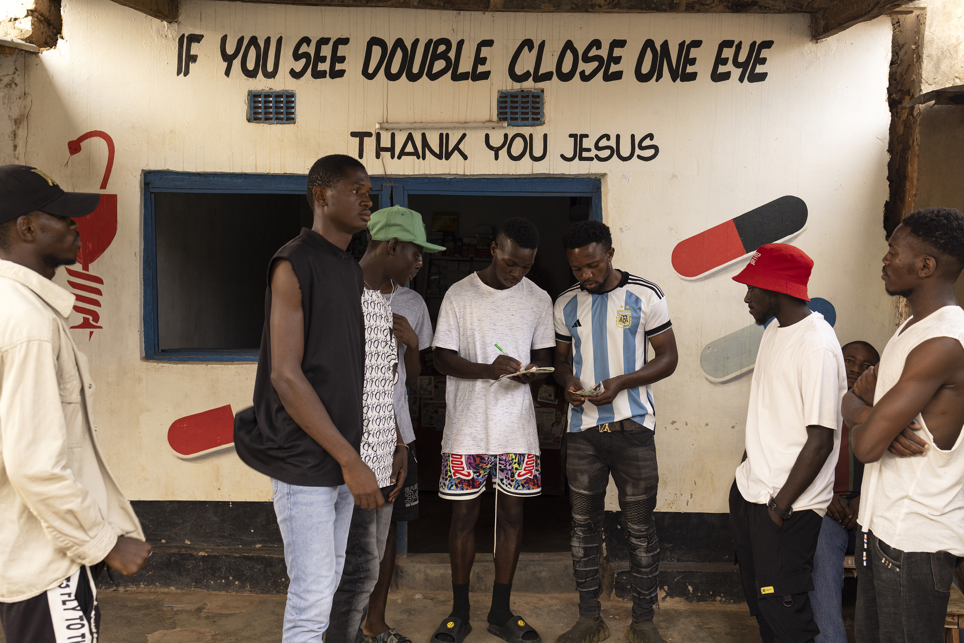 People gather in a marketplace in a refugee camp in Zambia