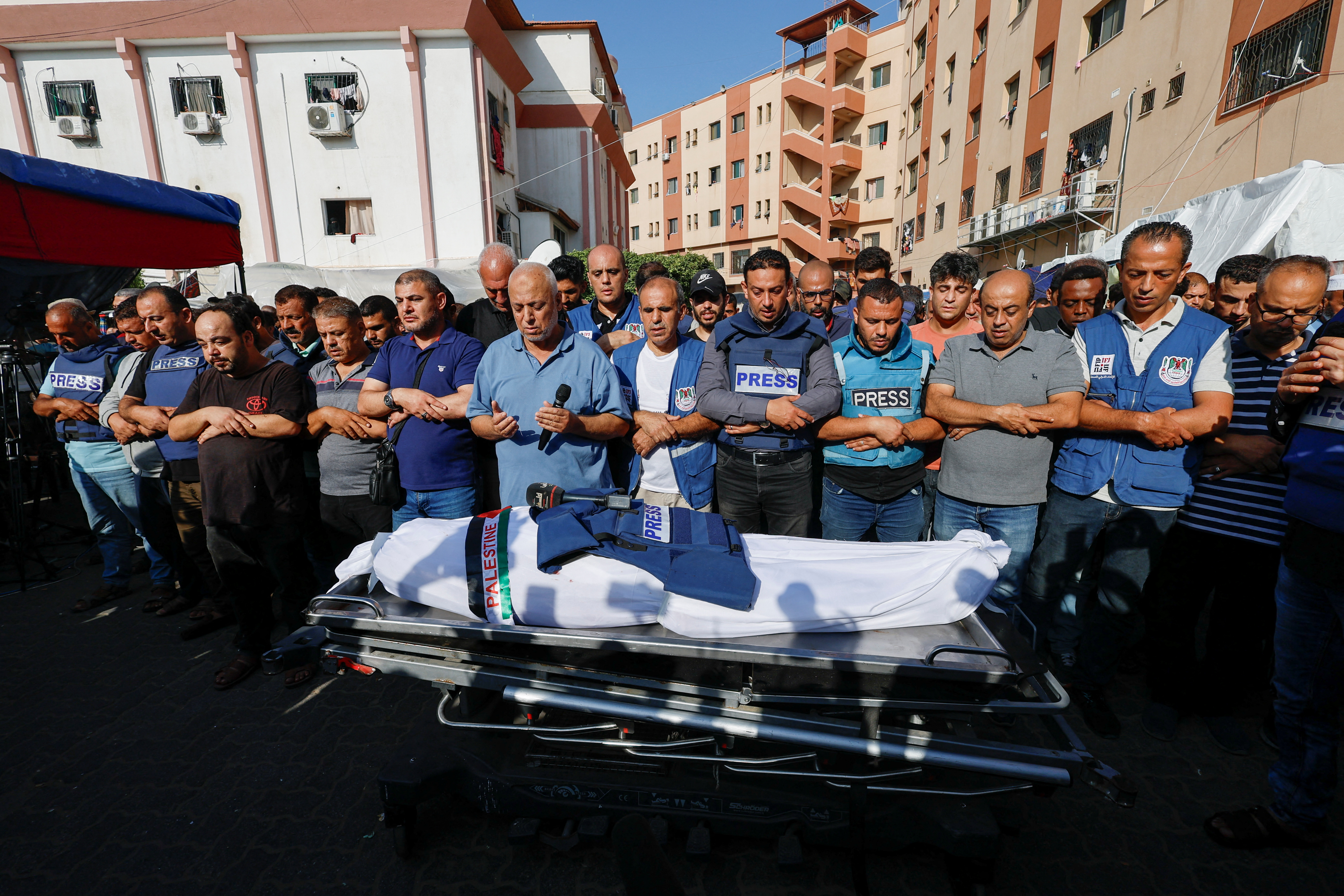 Mourners pray during the funeral of Palestinian journalist Mohammed Abu Hattab, who was killed in an Israeli strike, in Khan Younis in the southern Gaza Strip, November 3, 2023
